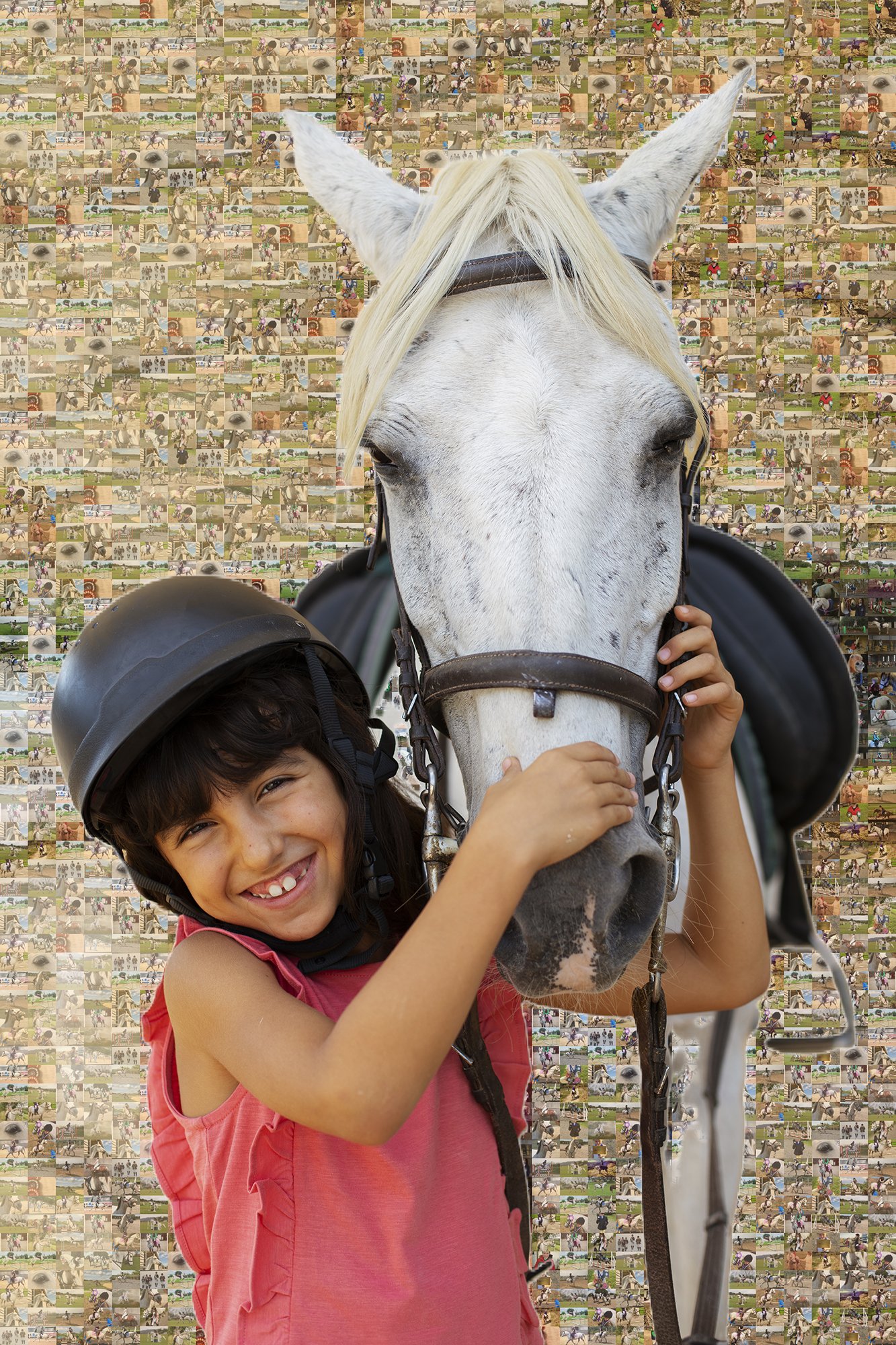 A smiling young female horse rider posing with her white pony.
