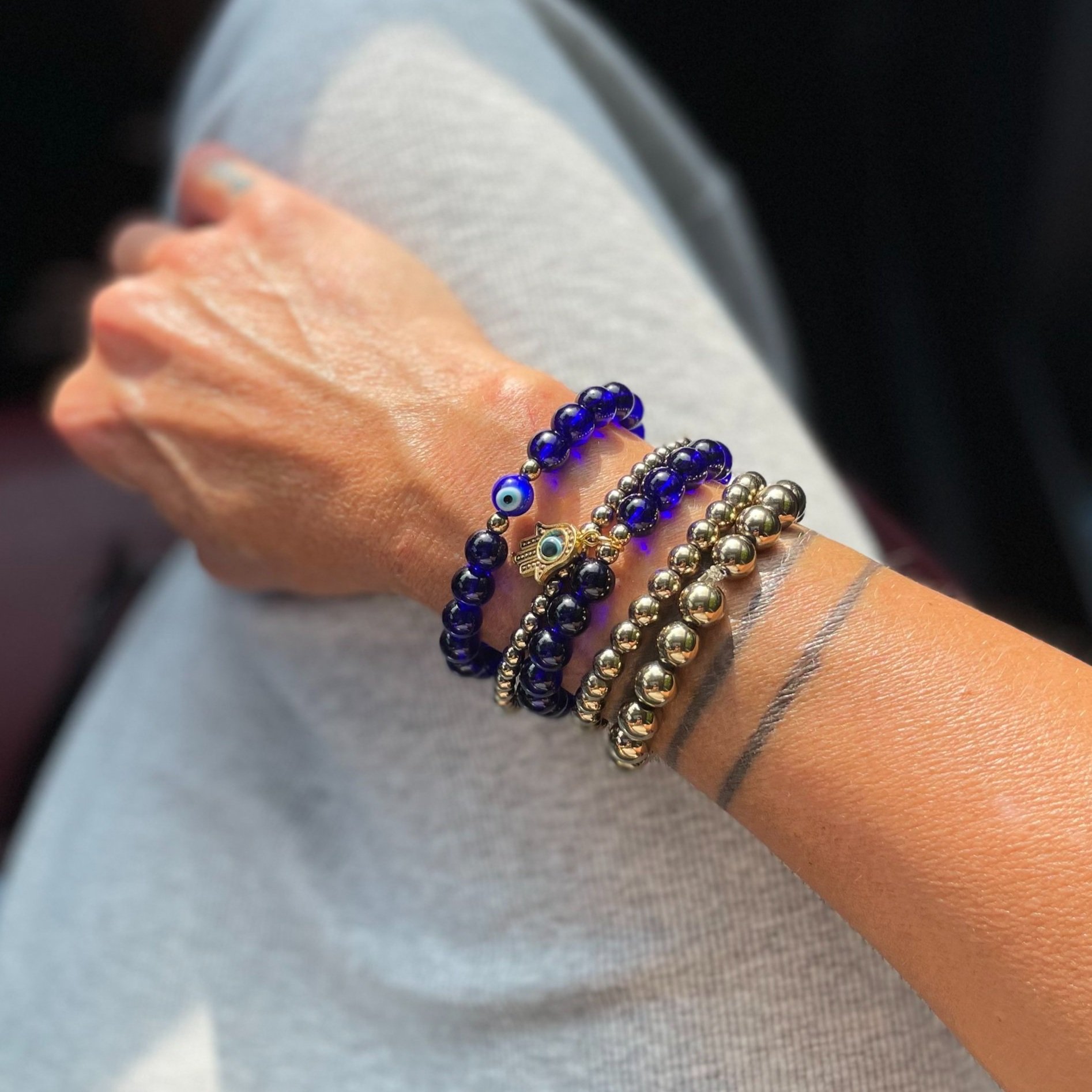 Azzura dark blue beaded bracelet with evil eye bead or hamsa charm