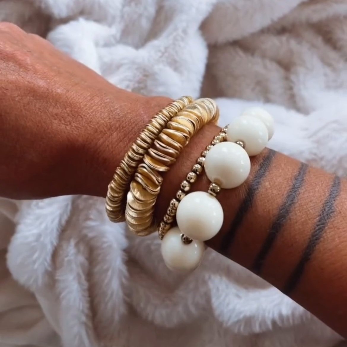 Chiara gold disc bracelet in 6mm and 10mm shown on wrist