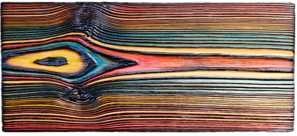 Close-up of multicolored stacked paper sheets with a prominent knot pattern in the center.