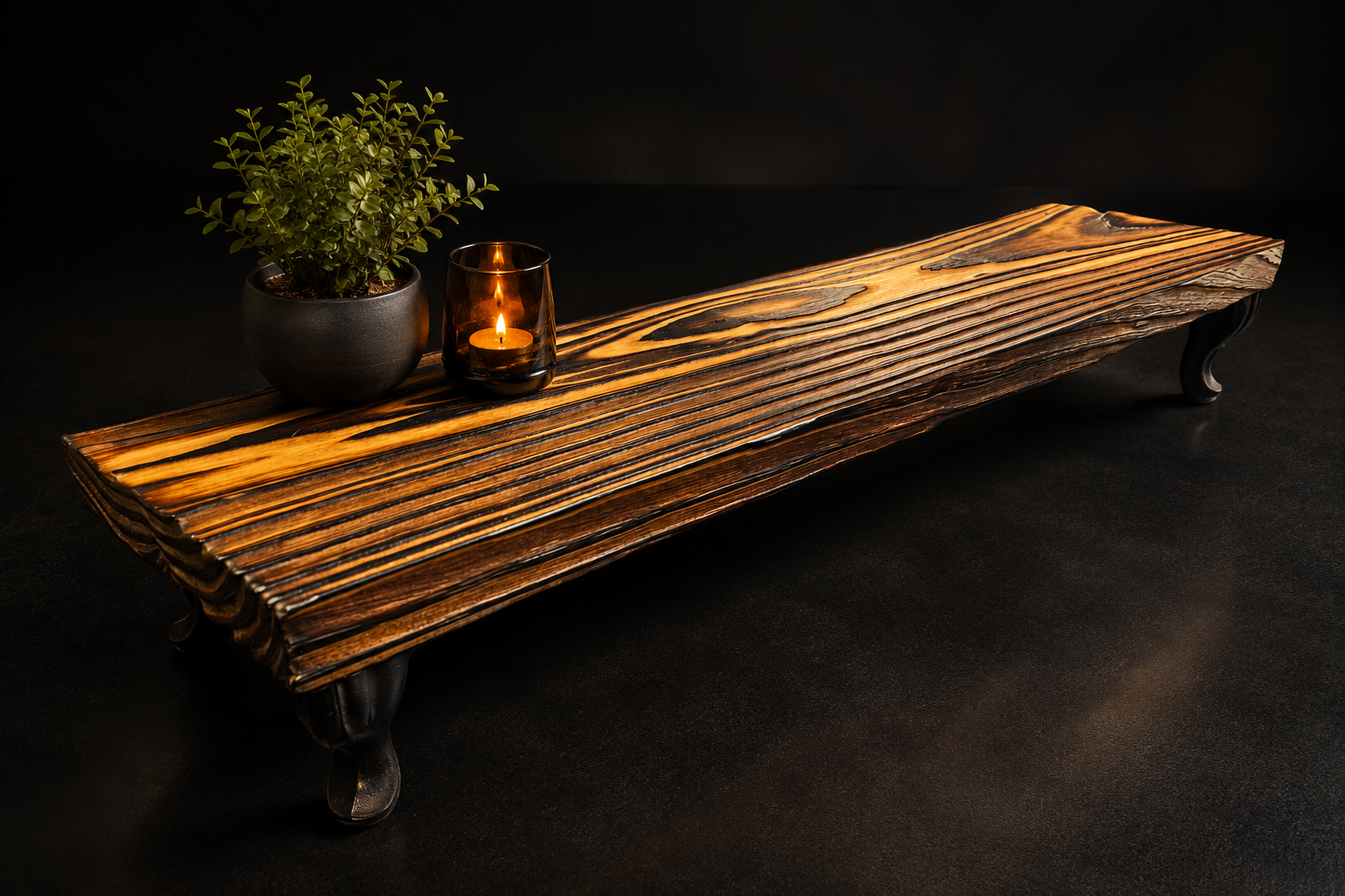FireForged™ wood table riser with curved black metal legs displayed against a dark background.