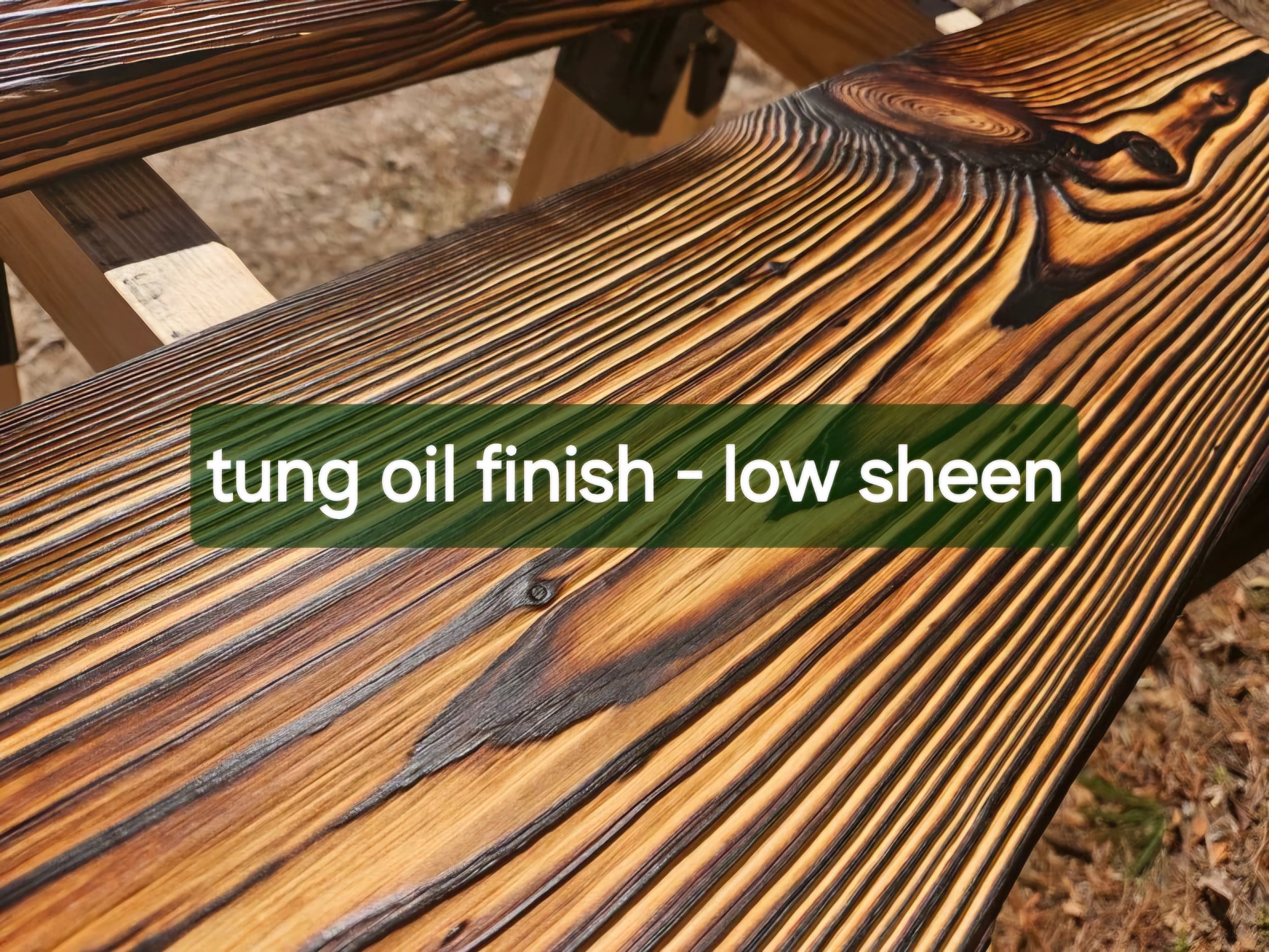 Close-up of a wooden bench with a dark stain finish, showing the detailed wood grain and knots.