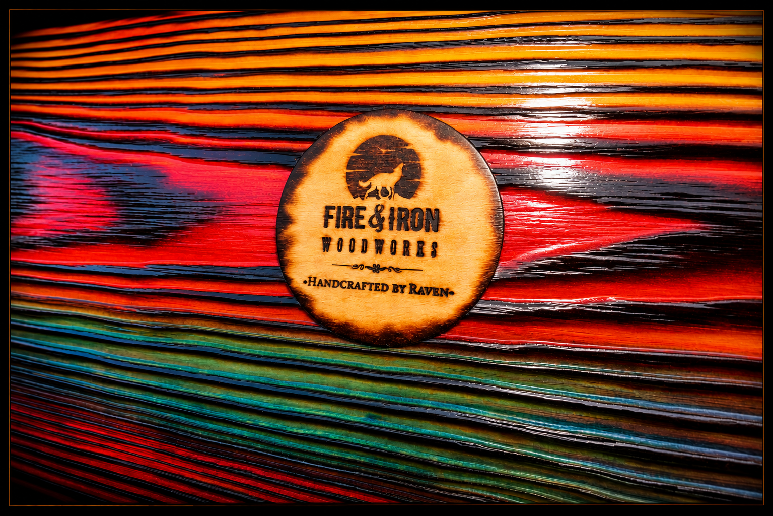 Fire & Iron Woodworks maker's mark displayed on colorful FireCandy™ wood plank.