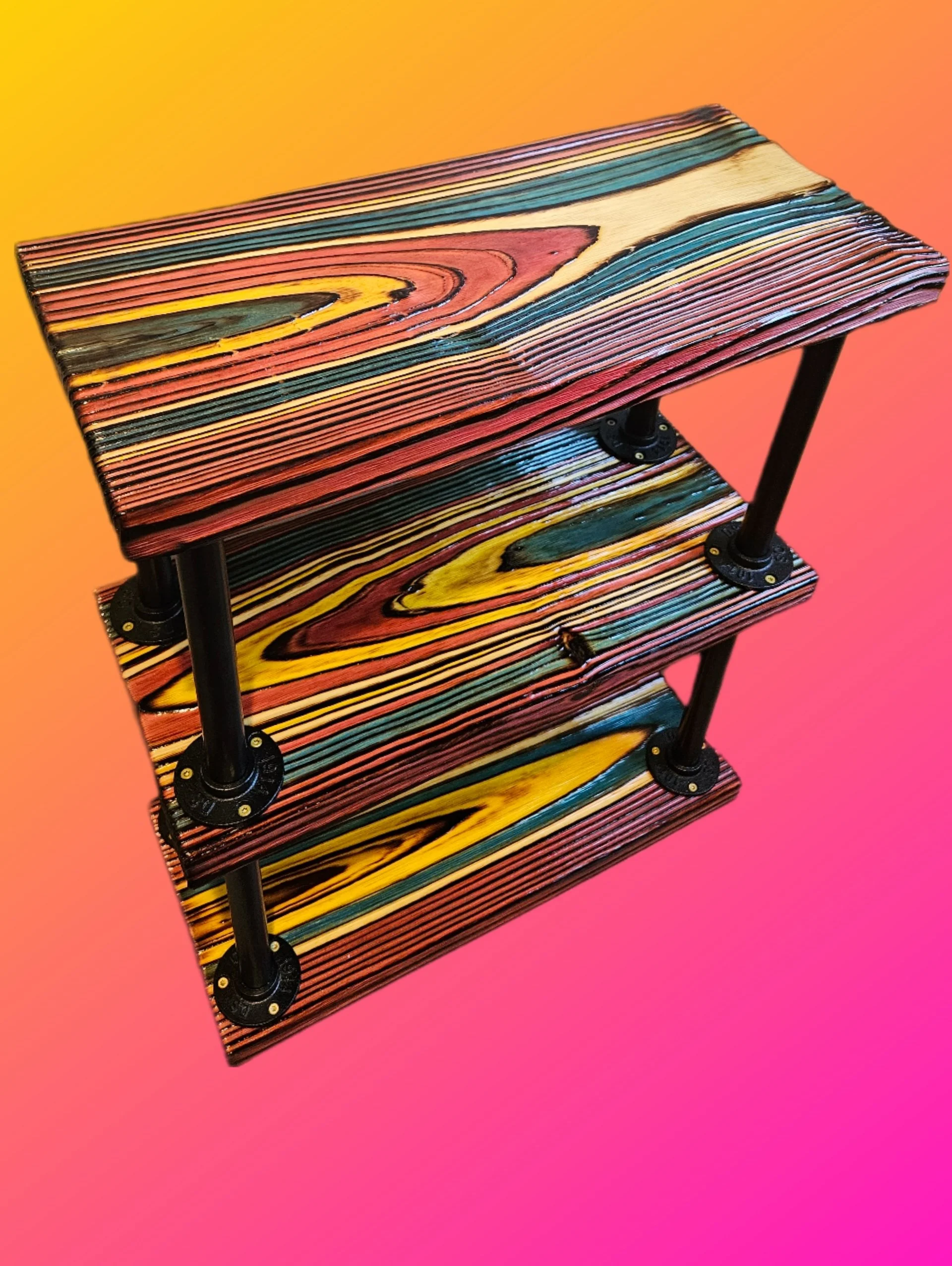 Colorful wooden shelving unit with multiple tiers, supported by black metal poles, against a pink and orange gradient background.