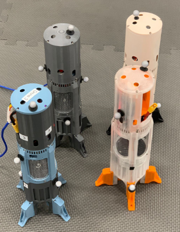 closeup of 4 firefly drones, cylindrical rocket shaped drones