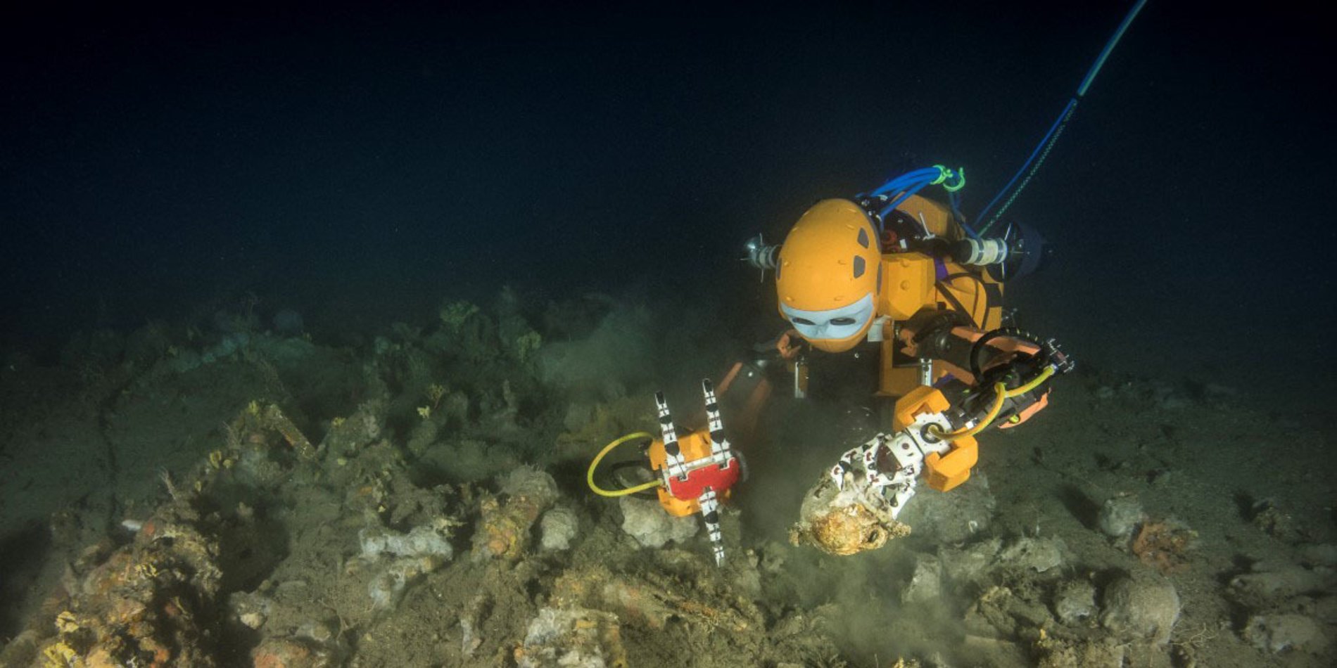 a closeup shot of the oceanonek, a humanoid submersible robot diving at the bottom of the sea