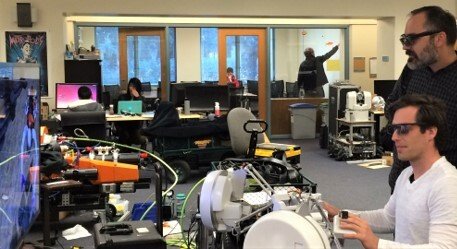 side angle shot of people piloting the oceanone experience