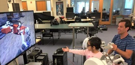 another side angle shot of people piloting the oceanone experience
