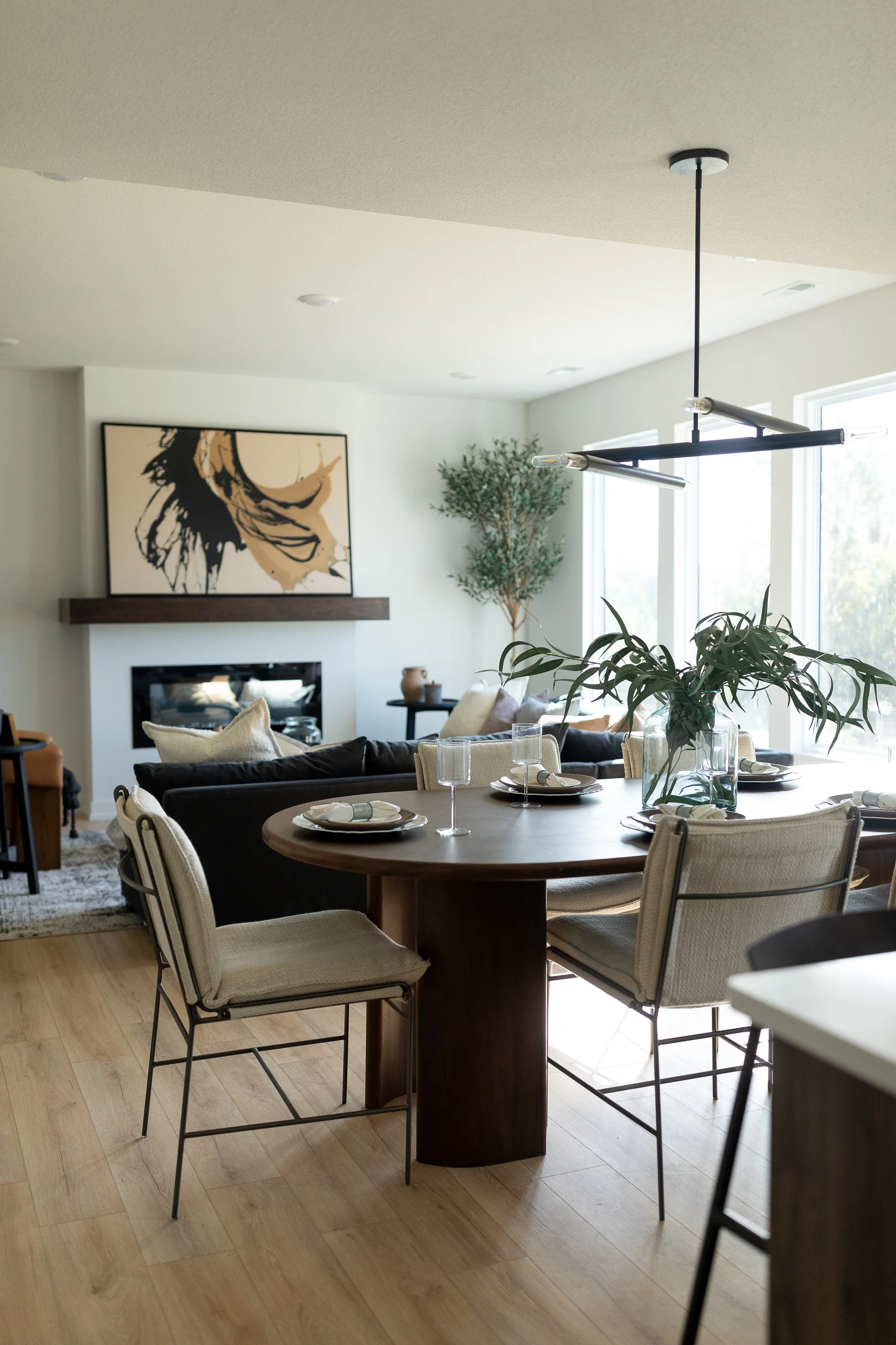 A zoomed out photo of a living and dining area for a new construction home.