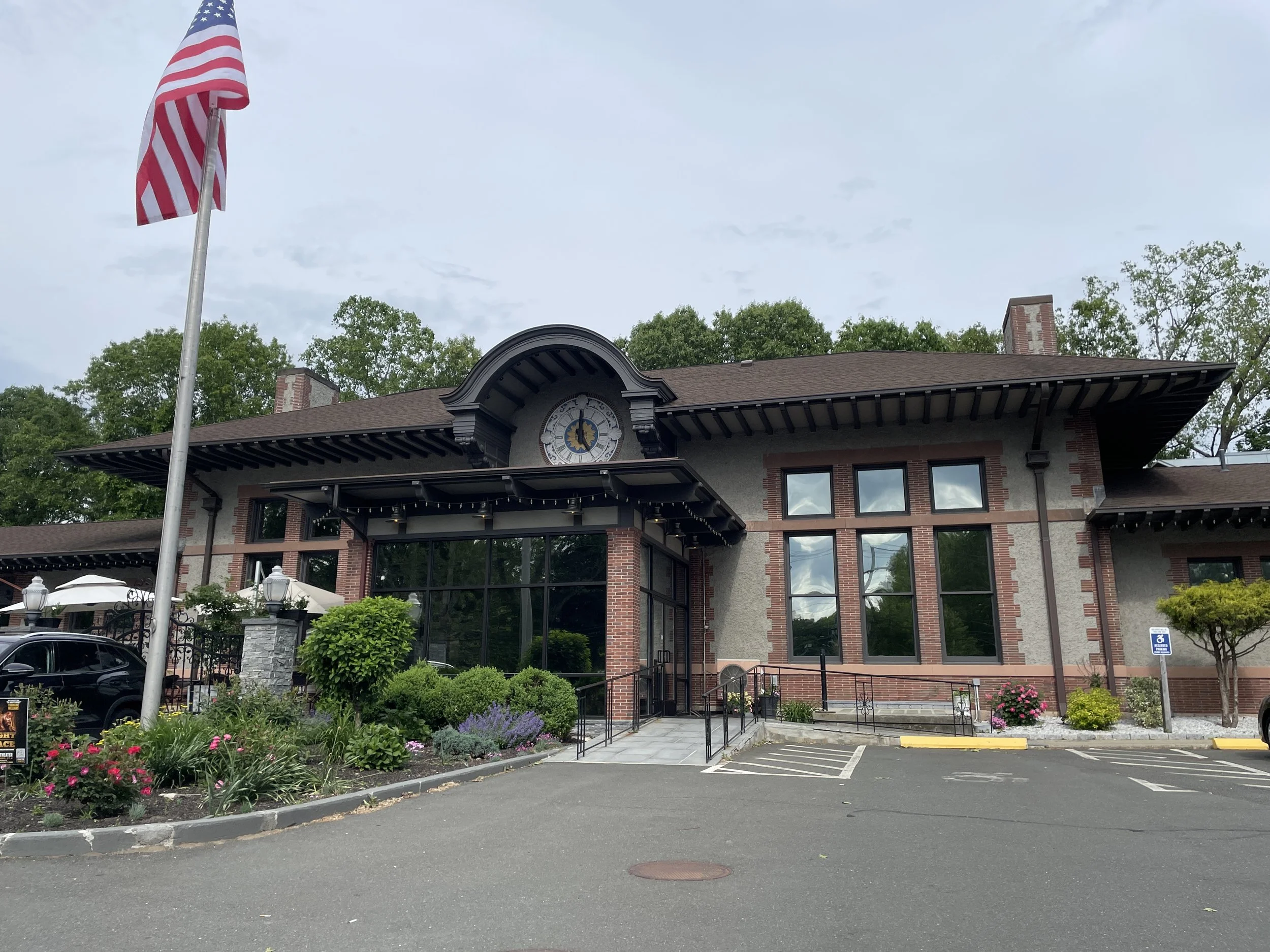 The Station Restaurant exterior with clock tower and outdoor patio Naugatuck CT