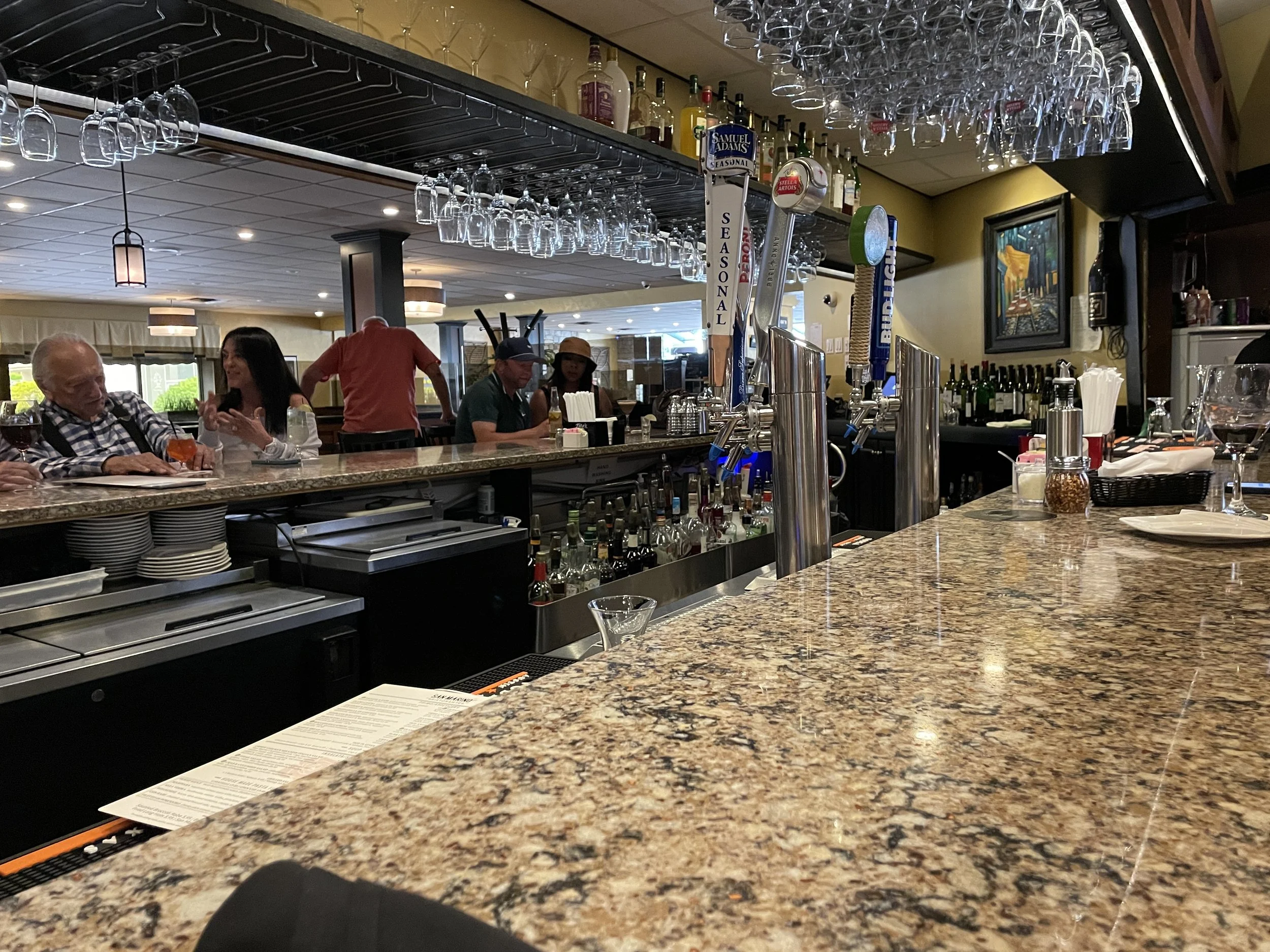 San Marino Restaurant horseshoe bar with draft taps and wine glasses Waterbury CT