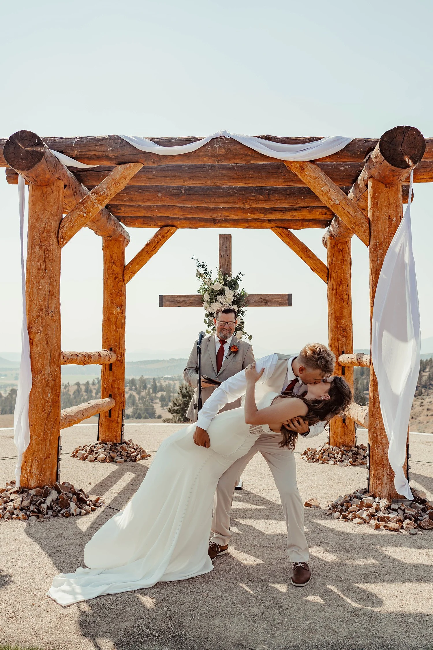 bride and groom kissing at their wedding
