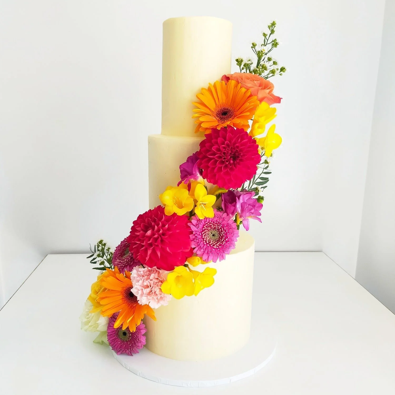 3 Tier Tall Smooth White Buttercream Finish with Seasonal Florals