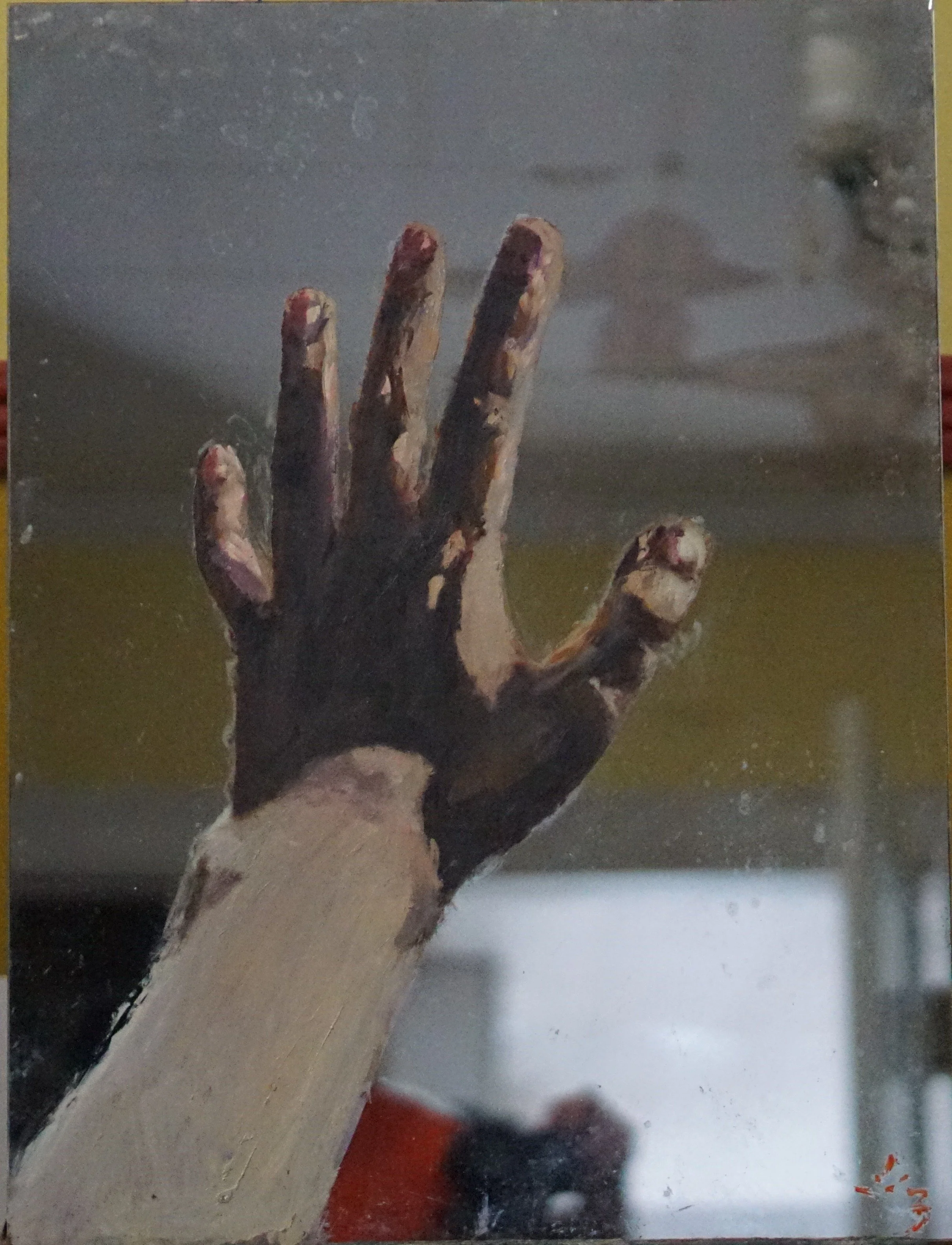 Painting of a hand on a mirror