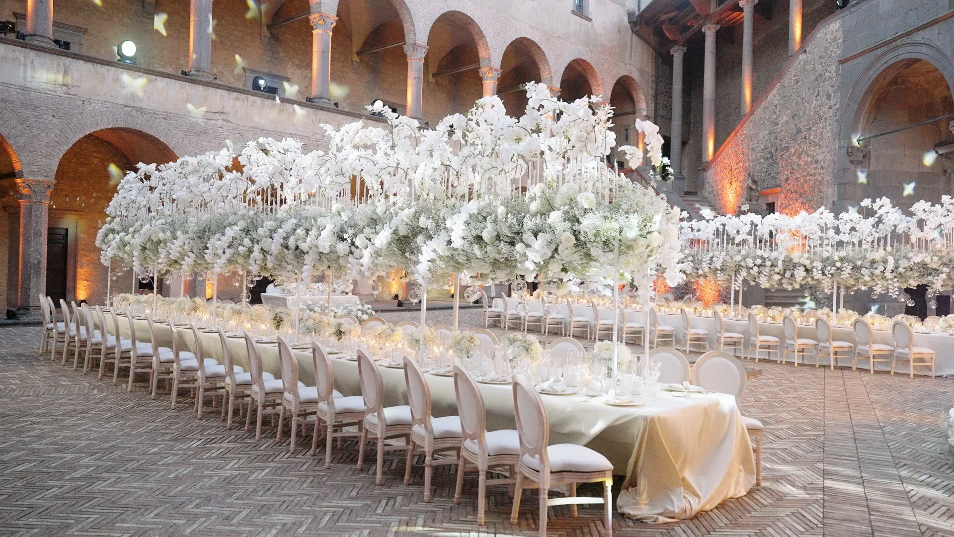 Elegant floral reception decorations inside Castello Odescalchi di Bracciano for Filip and Sally's wedding