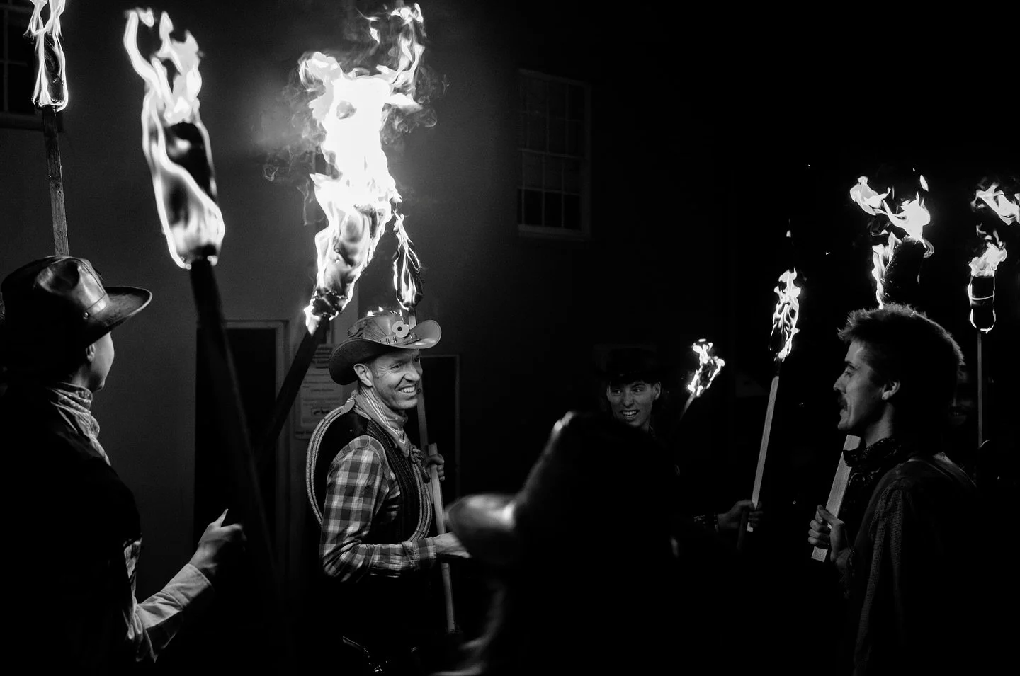 Lewes Bonfire Night, Part II.  Ears covered, flames high, street filled with smoke and noise.

#LewesBonfireNight #BonfireNight2025 #TorchlightParade #StreetPhotographyNight #BlackAndWhiteStreet #NightStreetMoments #DocumentaryPhotography #CrowdAndCh