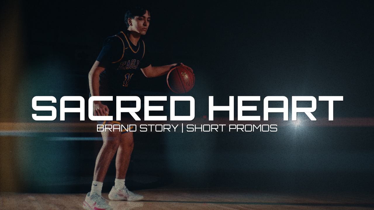 Young male basketball player holding a basketball in a dark gym, with text overlay reading "Sacred Heart Brand Story | Short Promos."