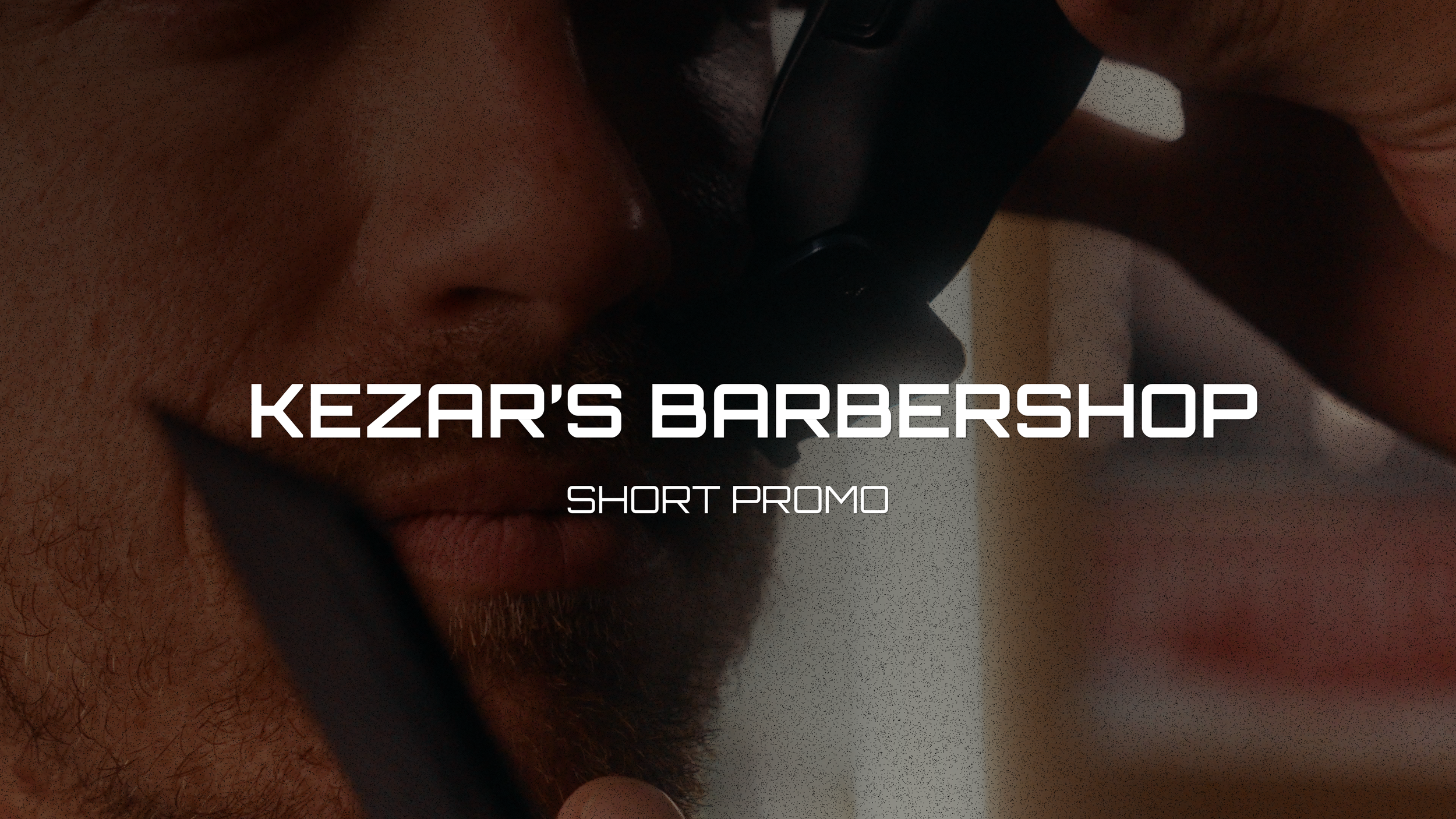 Close-up of a man's face with short hair and a beard, grooming with electric clippers at Kezar's Barbershop, with text overlay saying 'Kezar's Barbershop Short Promo.'