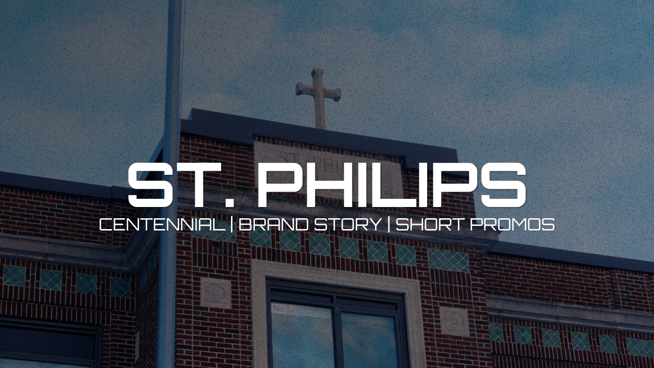 A brick church building with a cross on top and a sign on the wall, with overlaid text reading "St. Phillips, Centennial, Brand Story, Short Promos."
