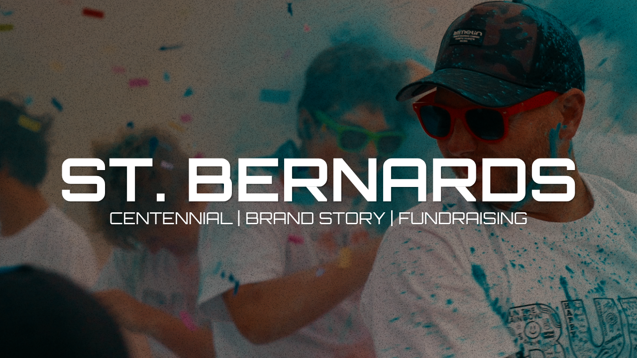 People celebrating at a St. Bernards event with confetti, wearing sunglasses and casual clothing.