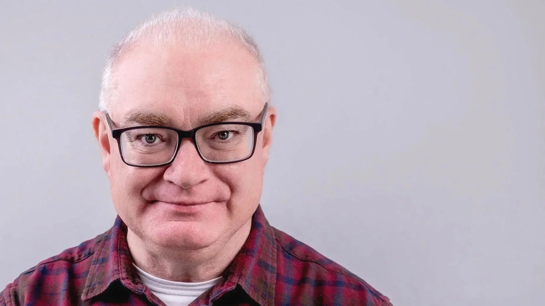 A close up photo of Jame Foley's face . He is the counsellor with Prevail.