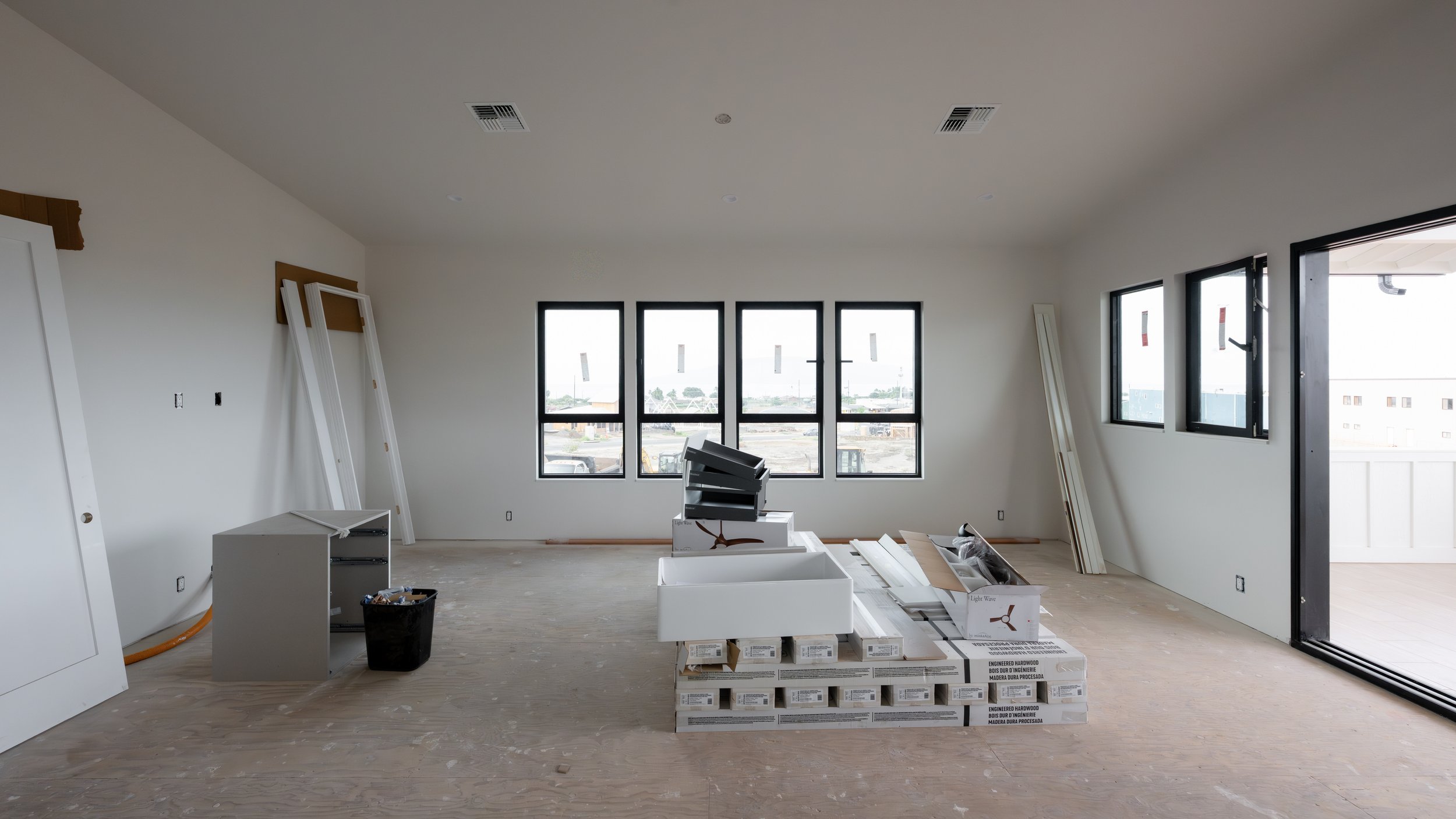 Architectural sketch of two modern houses with flat roofs and large windows, surrounded by minimal landscaping.