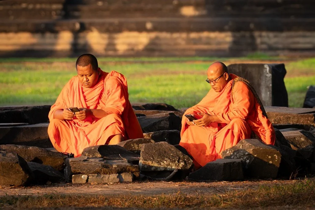 Old vs New  Monks at Ankor Wat Cambodia
