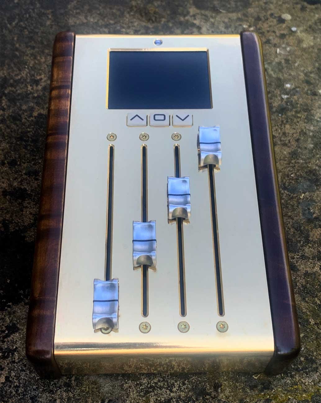 A custom brass and hard wood programmable MIDI fader with TDK or K-Faders