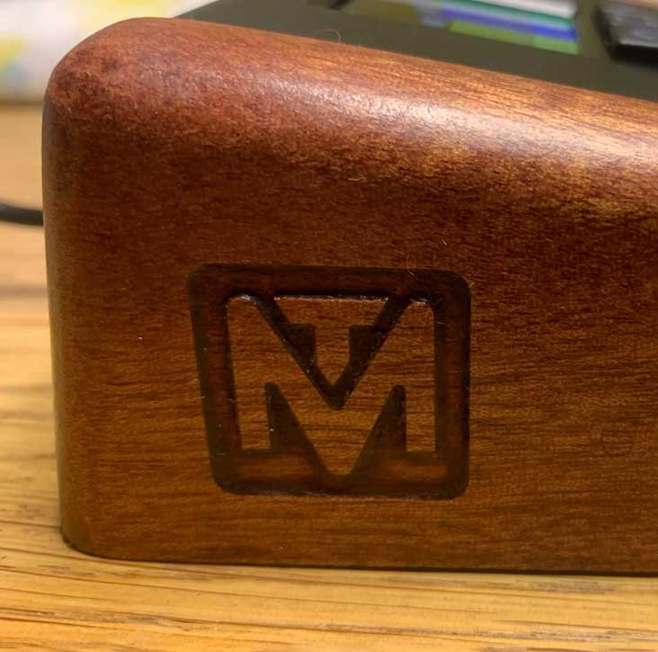 The logo of MusioTech, engraved on a custom programmable MIDI fader