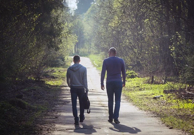 Image of people walking which supports our philosophy of walking beside someone at keystone lodge