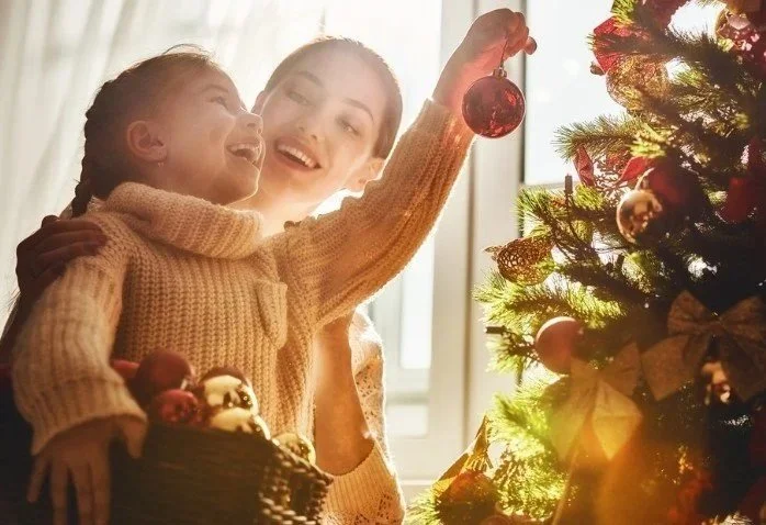 Mother with Daughter - decorating Christmas tree.jpg
