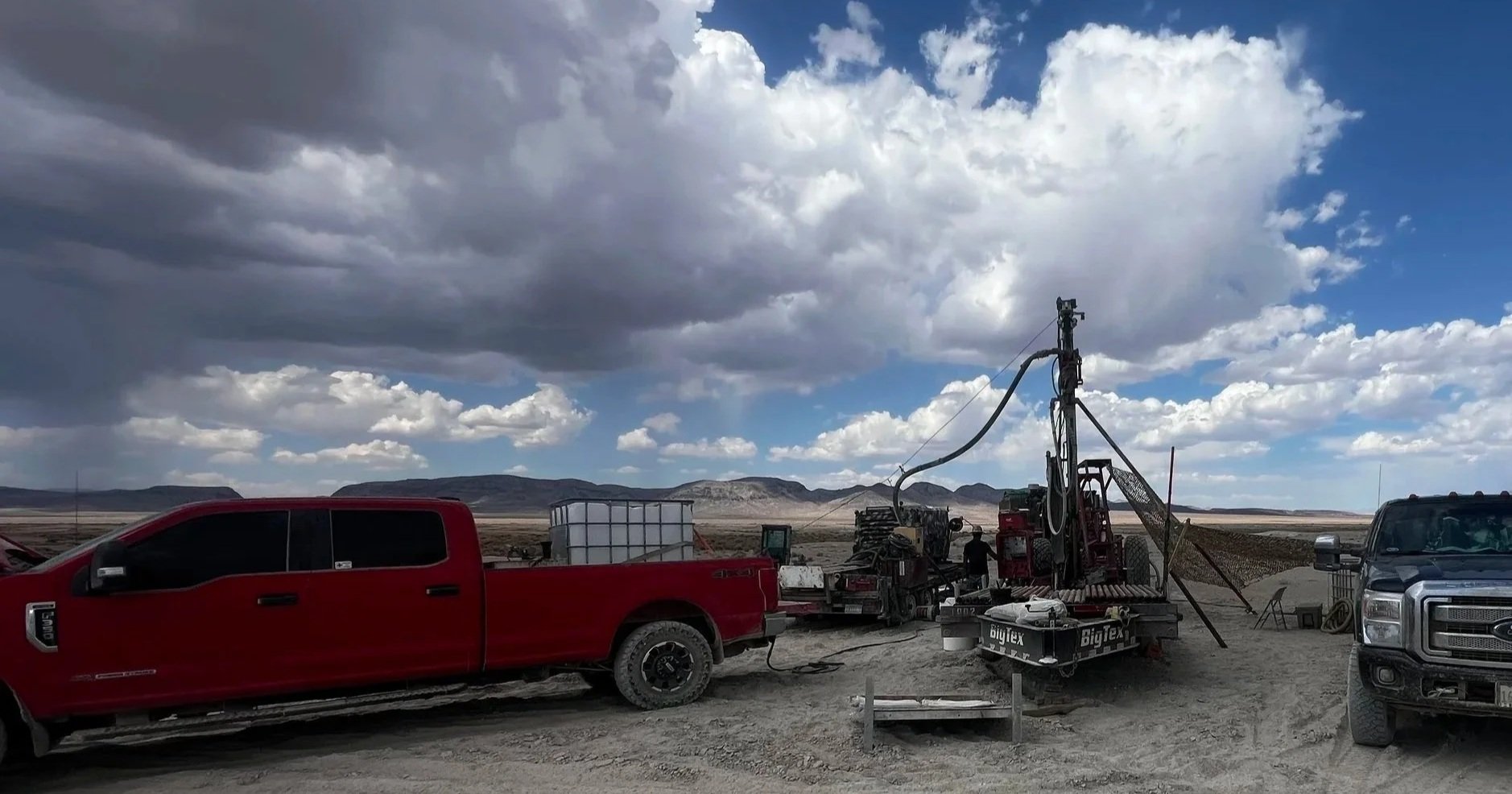 Diesel Rig and Two Diesel trucks at a rig in Nevada