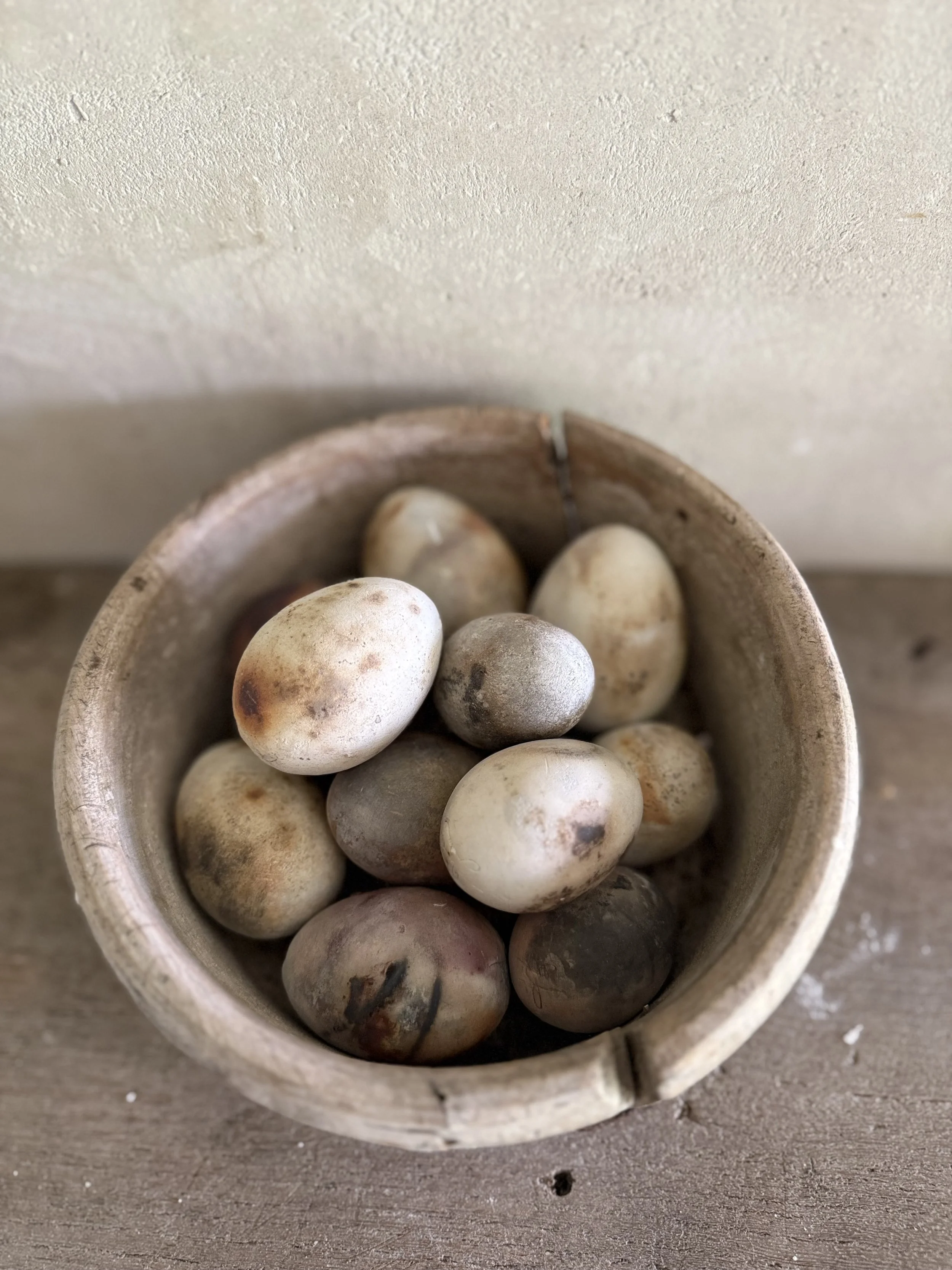 Wabi sabi ancient wooden bowl with 11 porcelain eggs
