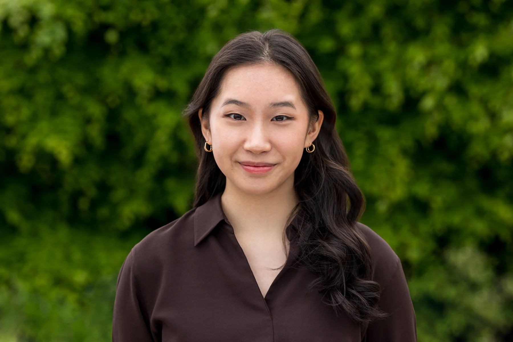 Outdoor headshot, London — professional corporate portrait with green background, Shot By Andrew