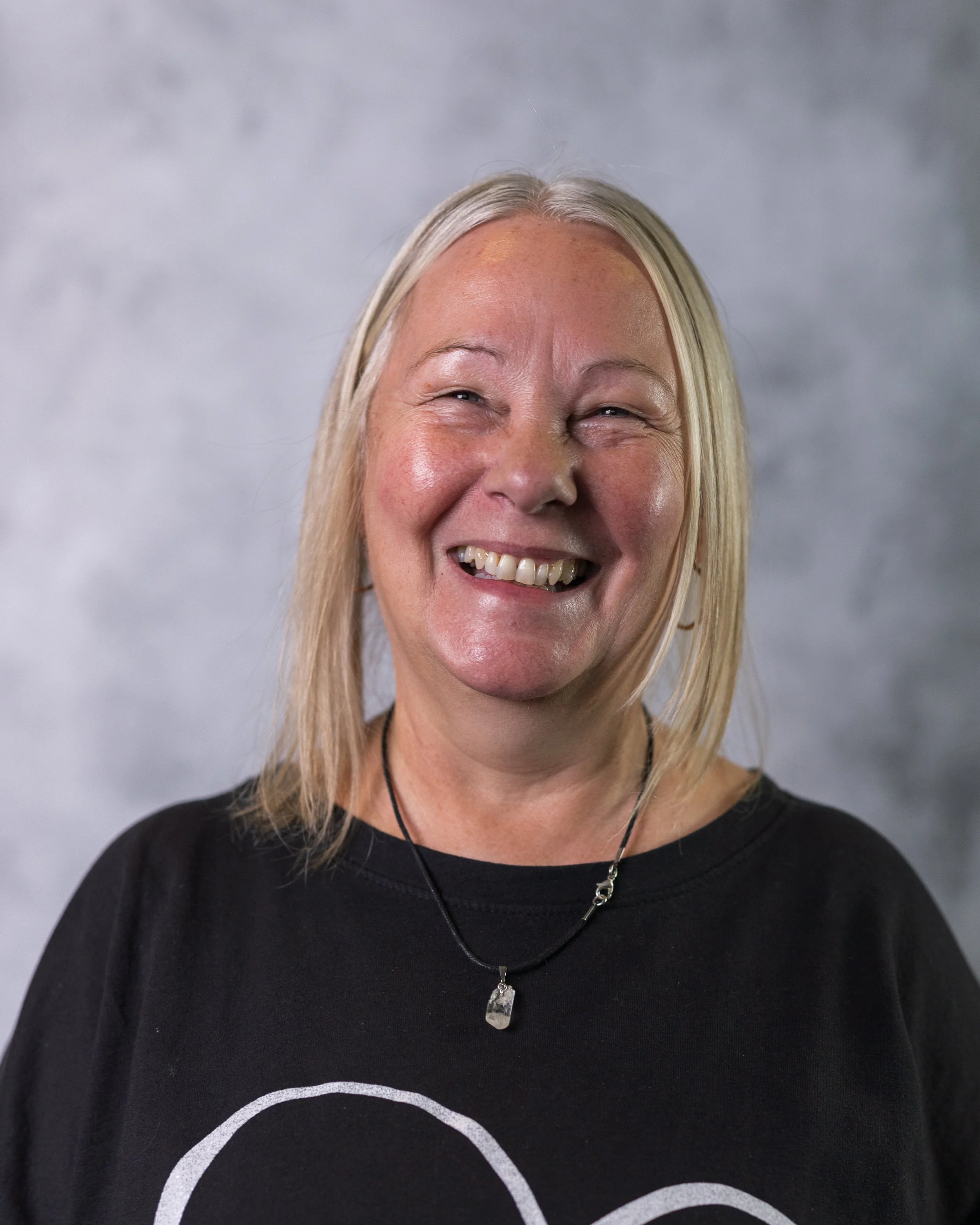 Smiling woman taking part in a portrait session in a Wimbledon studio