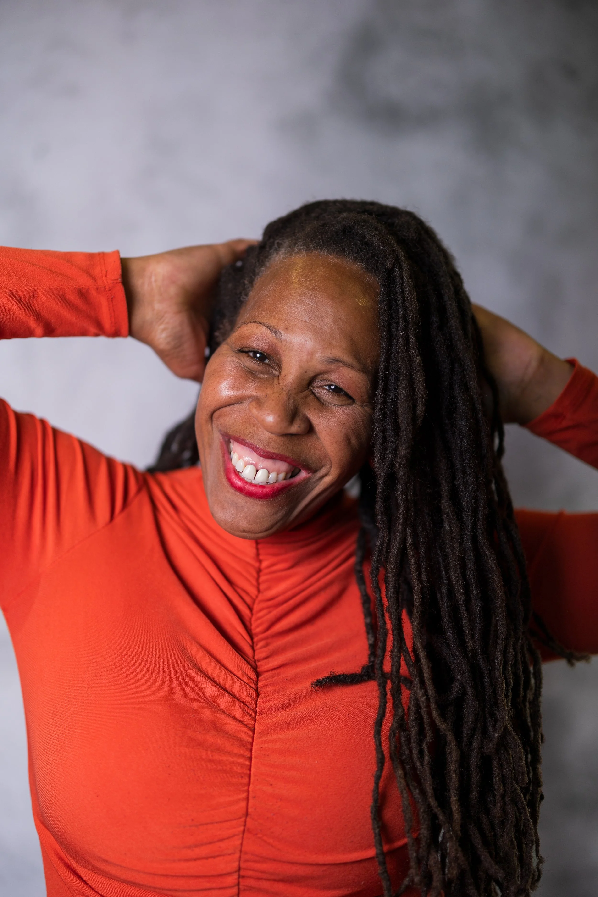 Grinning woman taking part portrait photography session