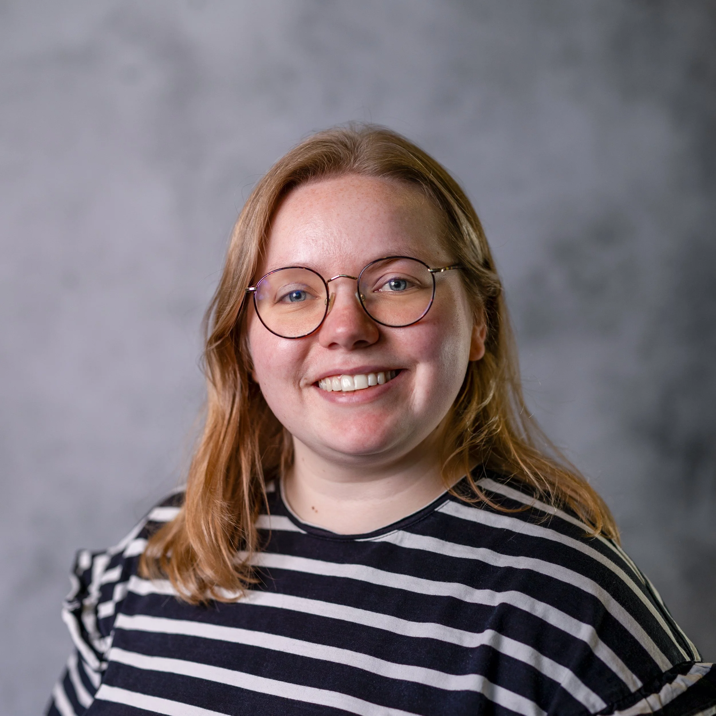 Smiling Woman in an actors headshot Wimbledon