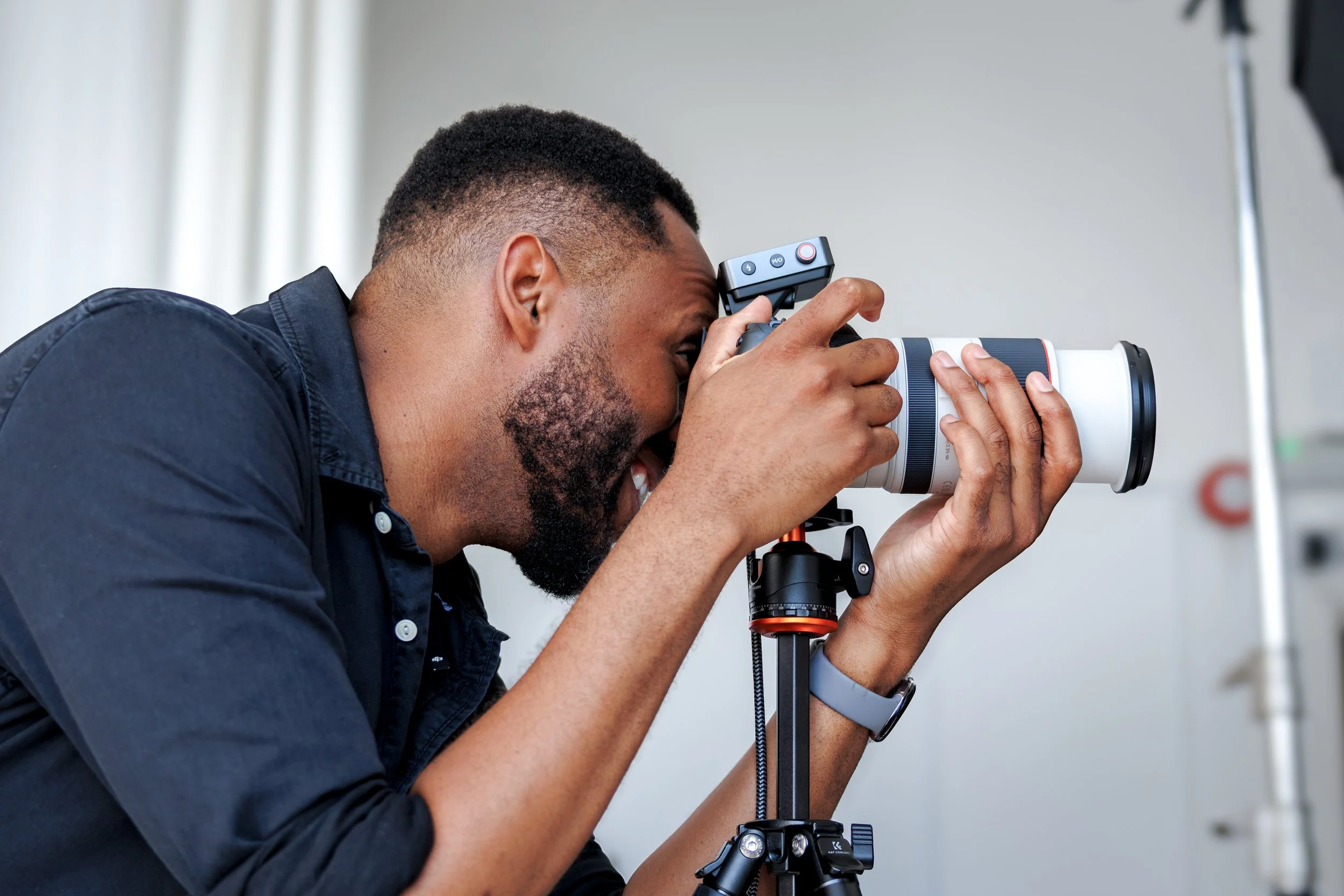 London corporate photographer shooting executive headshots on a tripod against a studio backdrop