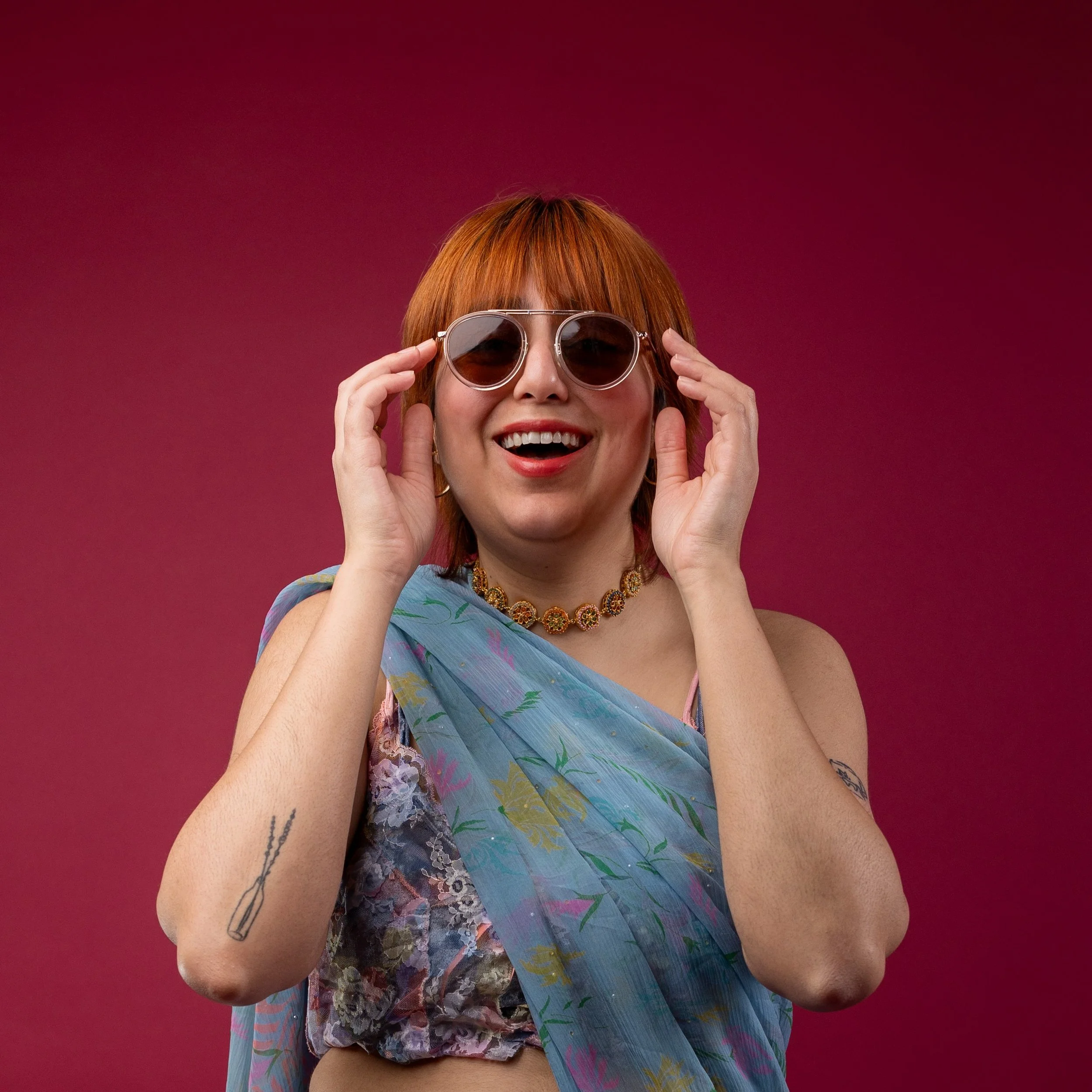 Headshot of a woman with glasses in a Wimbledon studio