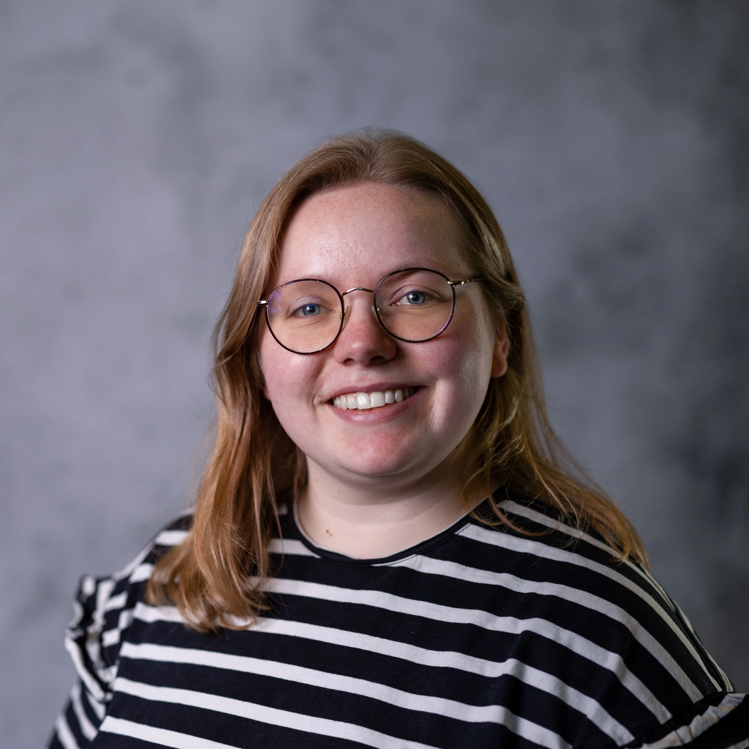 Smiling Woman in an actors headshot Wimbledon