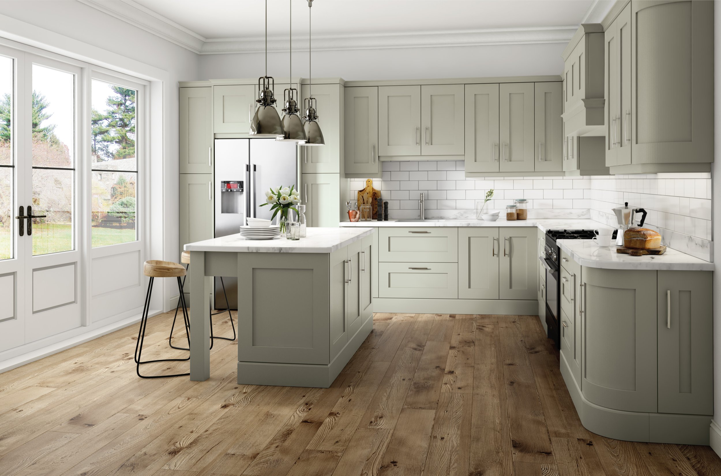 Modern kitchen with light green cabinets, white subway tile backsplash, and a white marble island. Features stainless steel appliances, pendant lighting, wooden floors, and a glass door leading to a garden view.
