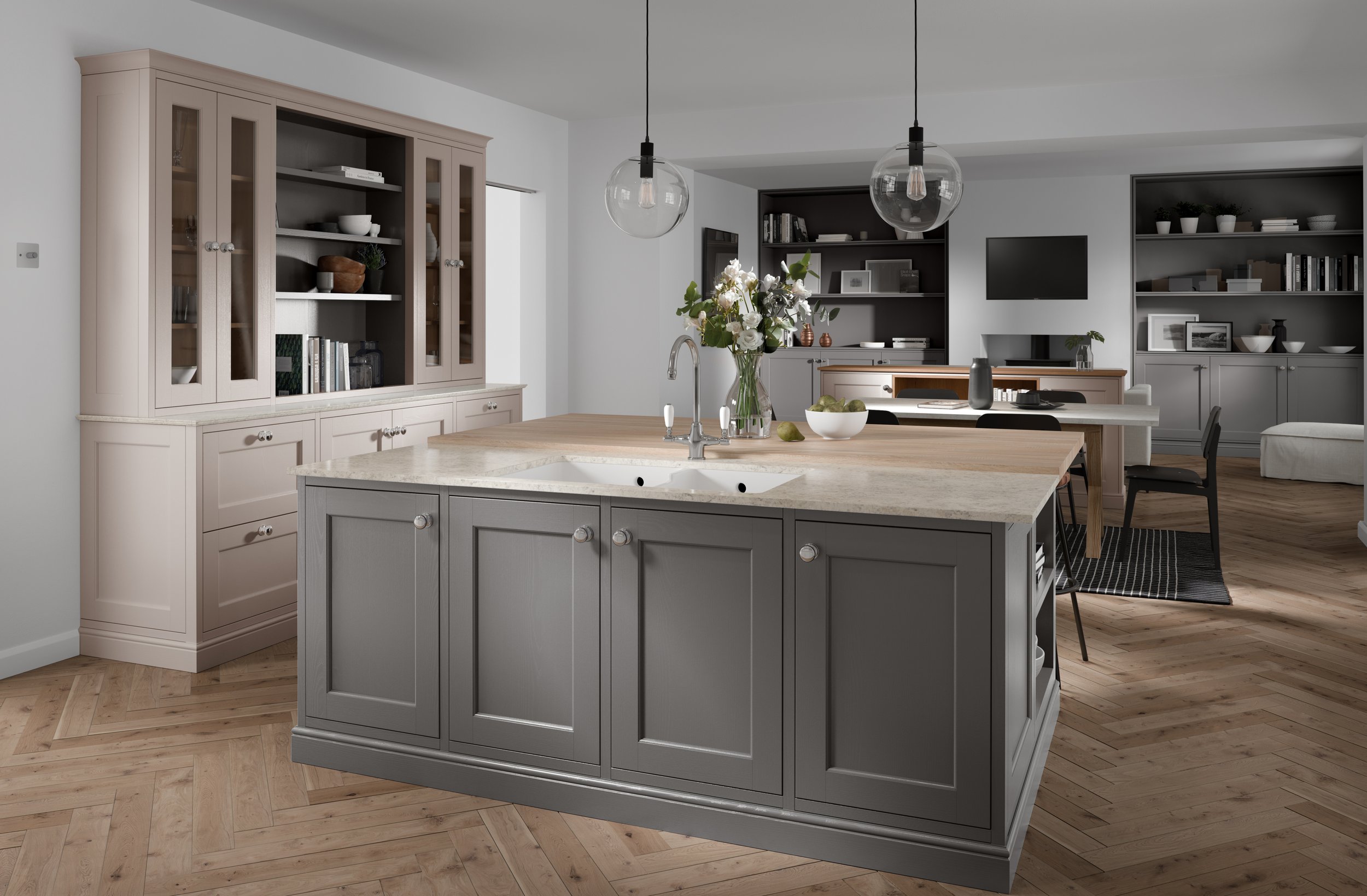 Modern kitchen interior with a large kitchen island, light gray cabinets, wooden flooring, pendant lighting, and open shelving with decor items.