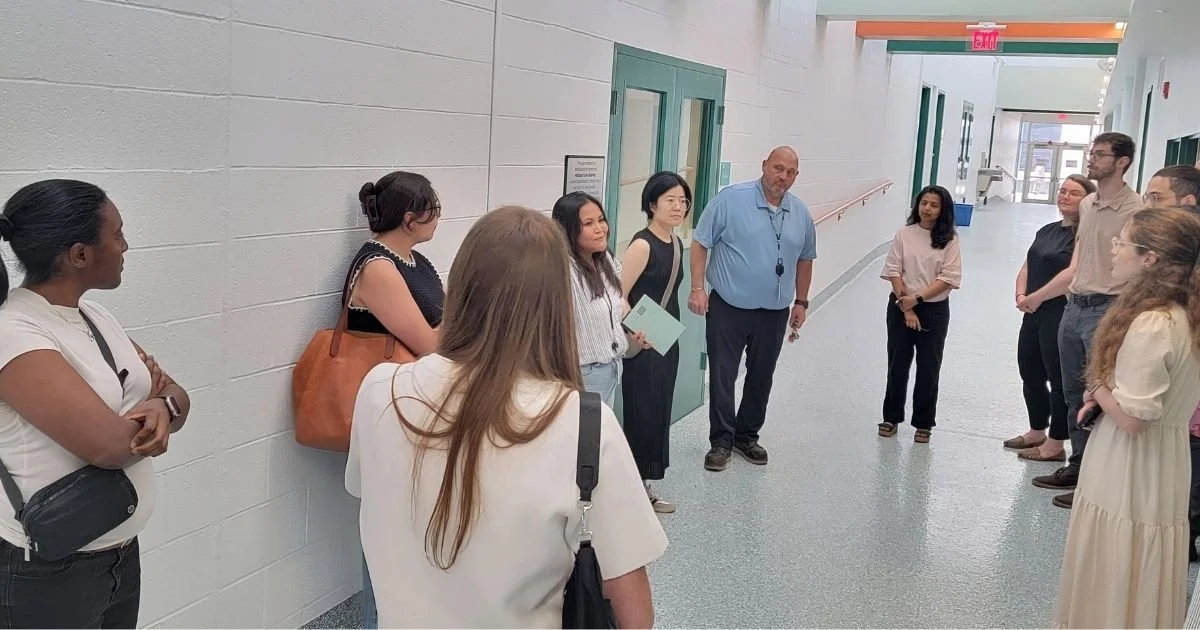 Designers and project managers lead a renovation tour of the Helen Moore Community Center in Detroit, a space honoring activist Helen "Mother" Moore's six-decade legacy of racial justice and educational equity for Black Detroiters.