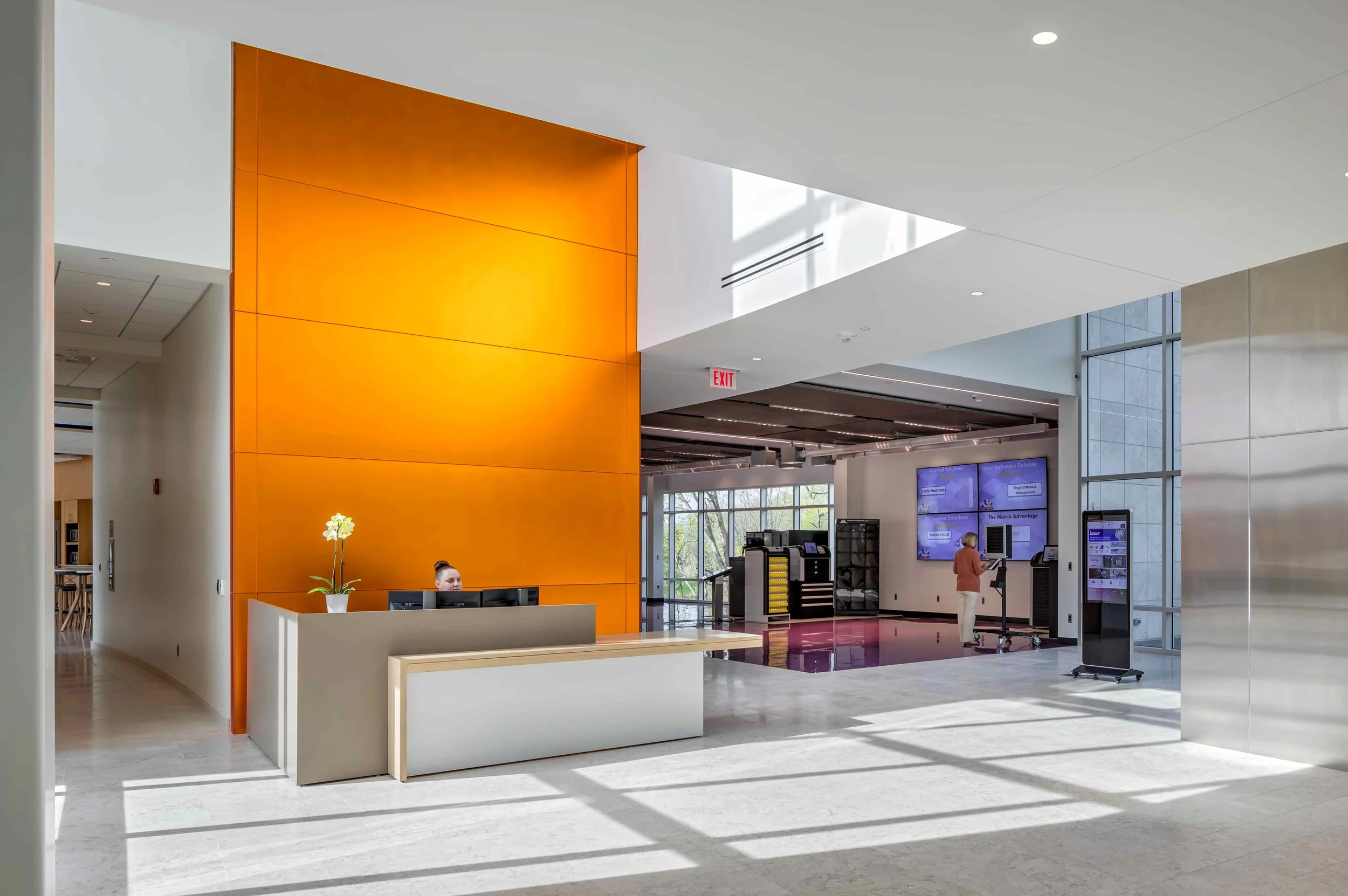 Corporate office entrance and reception area, commercial interior design by Albert Kahn Associates