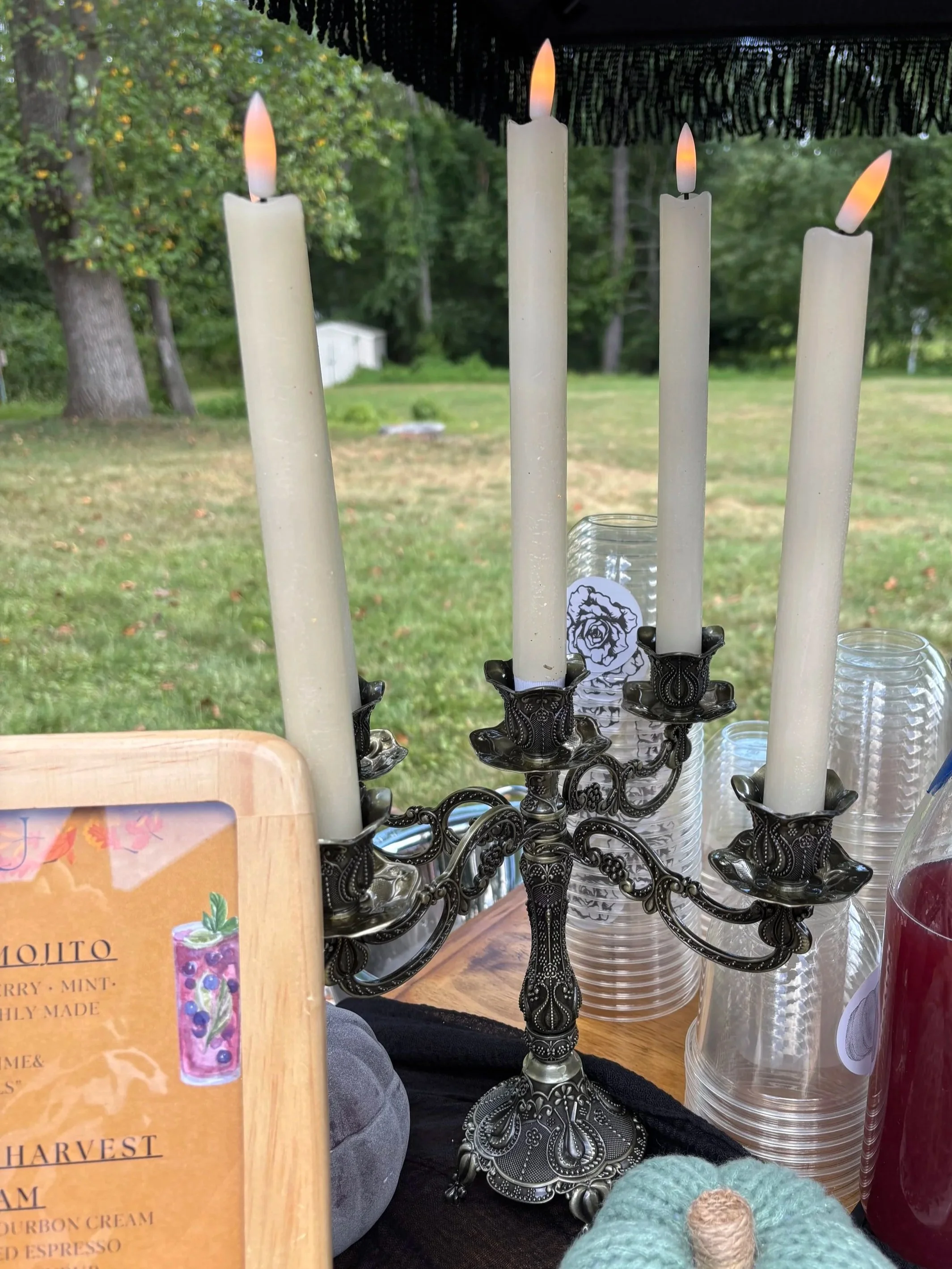 Elegant candle décor displayed at The Black Rose Bar luxury mobile bar setup for an outdoor New Jersey event, reflecting our refined event styling.