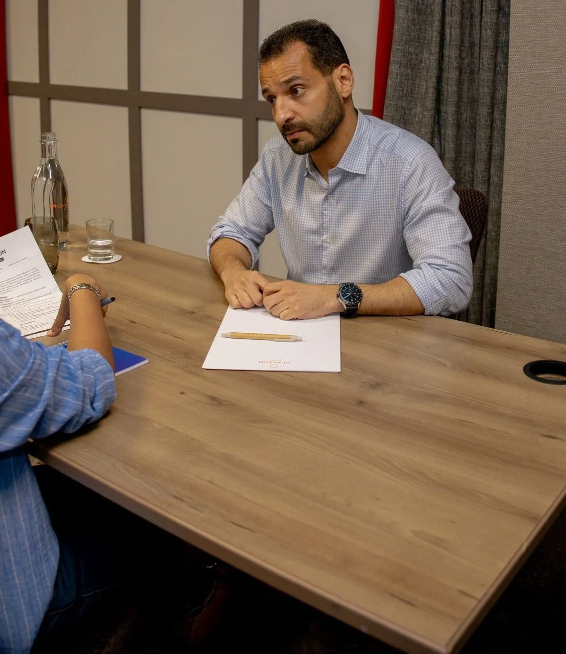 Kamal El Sheikh coaching a client in conversation.