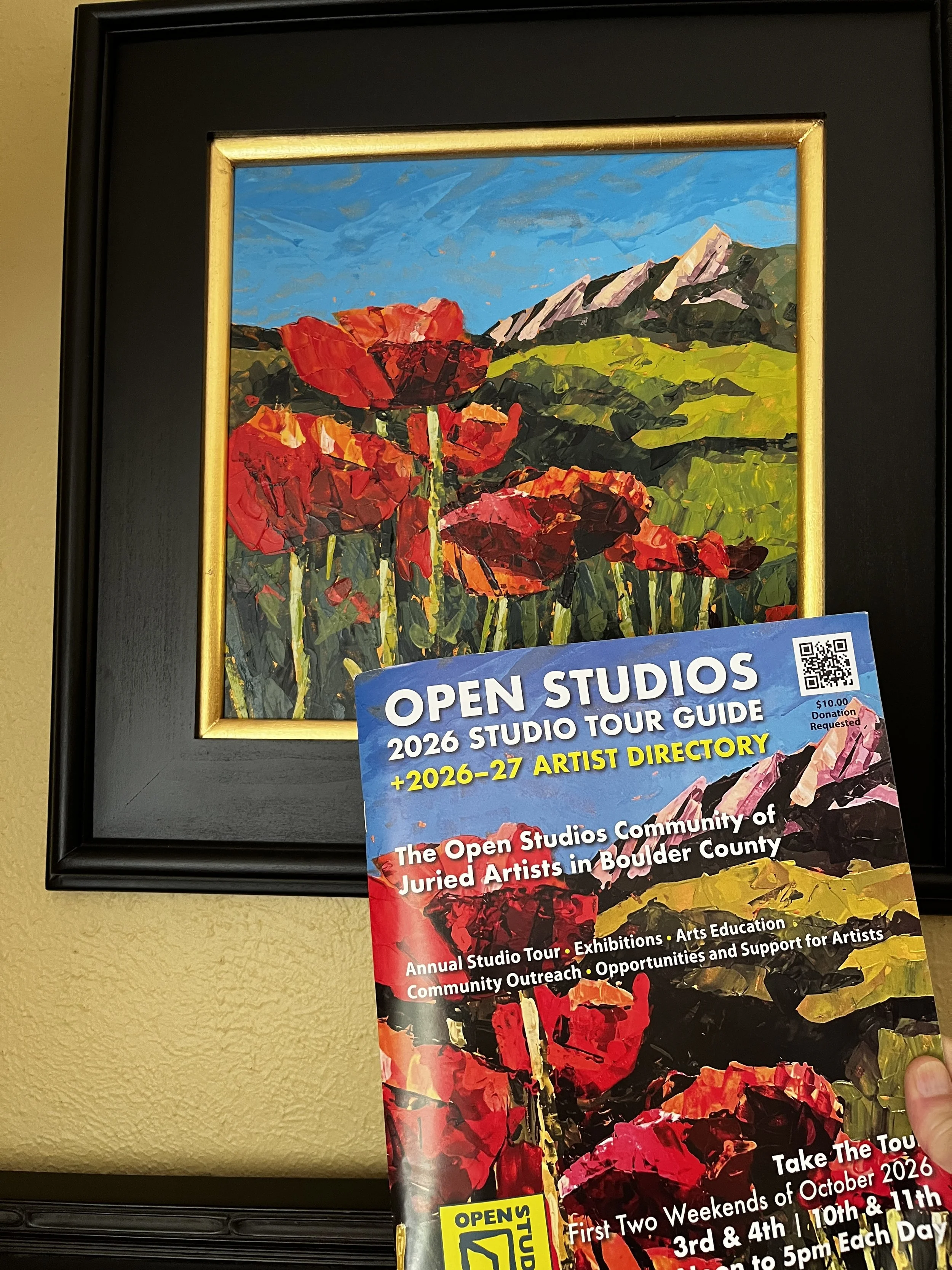 Guidebook next to painting