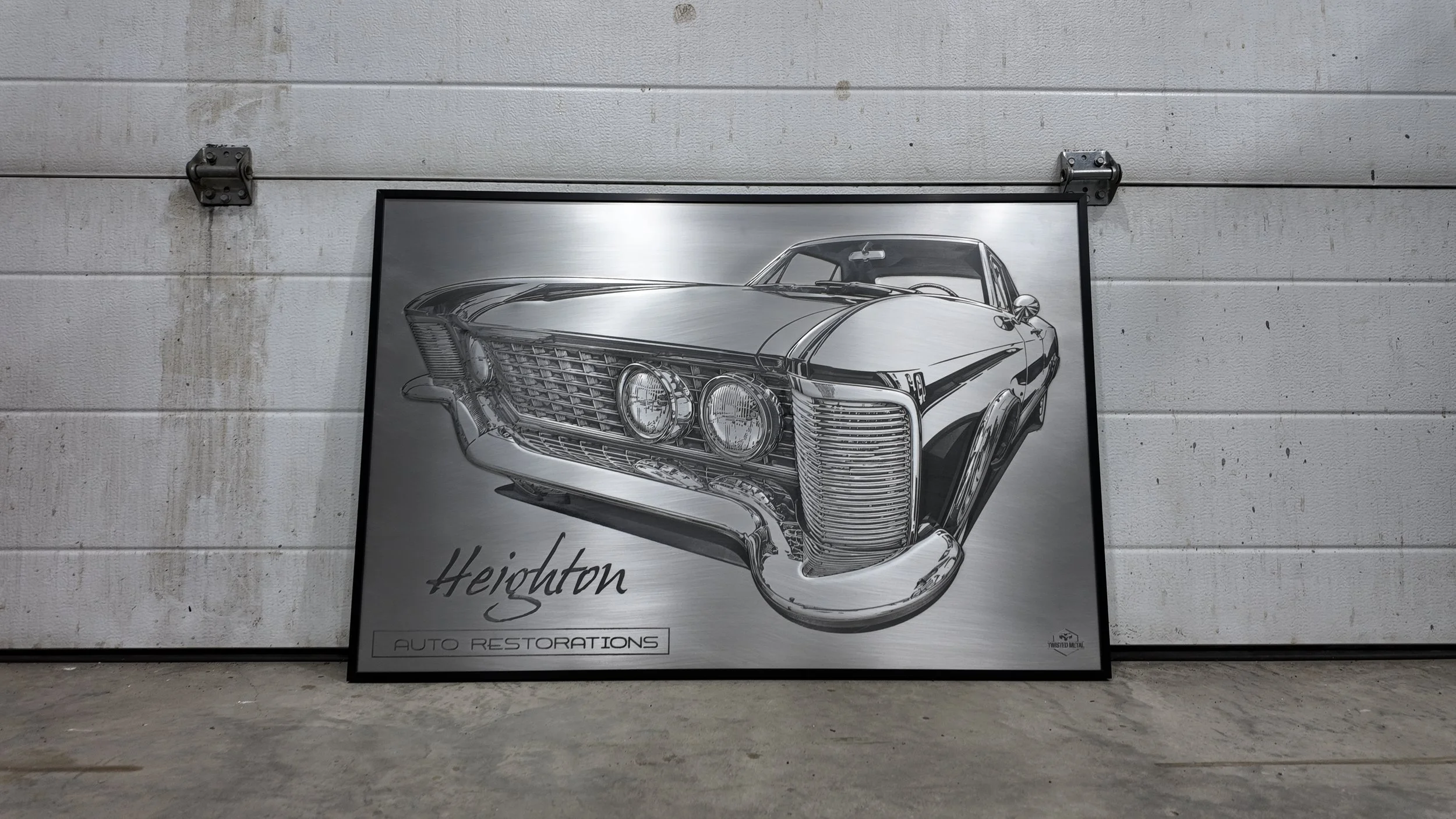 Black and white poster of a classic car, with the words "Heights Auto Restorations" below.