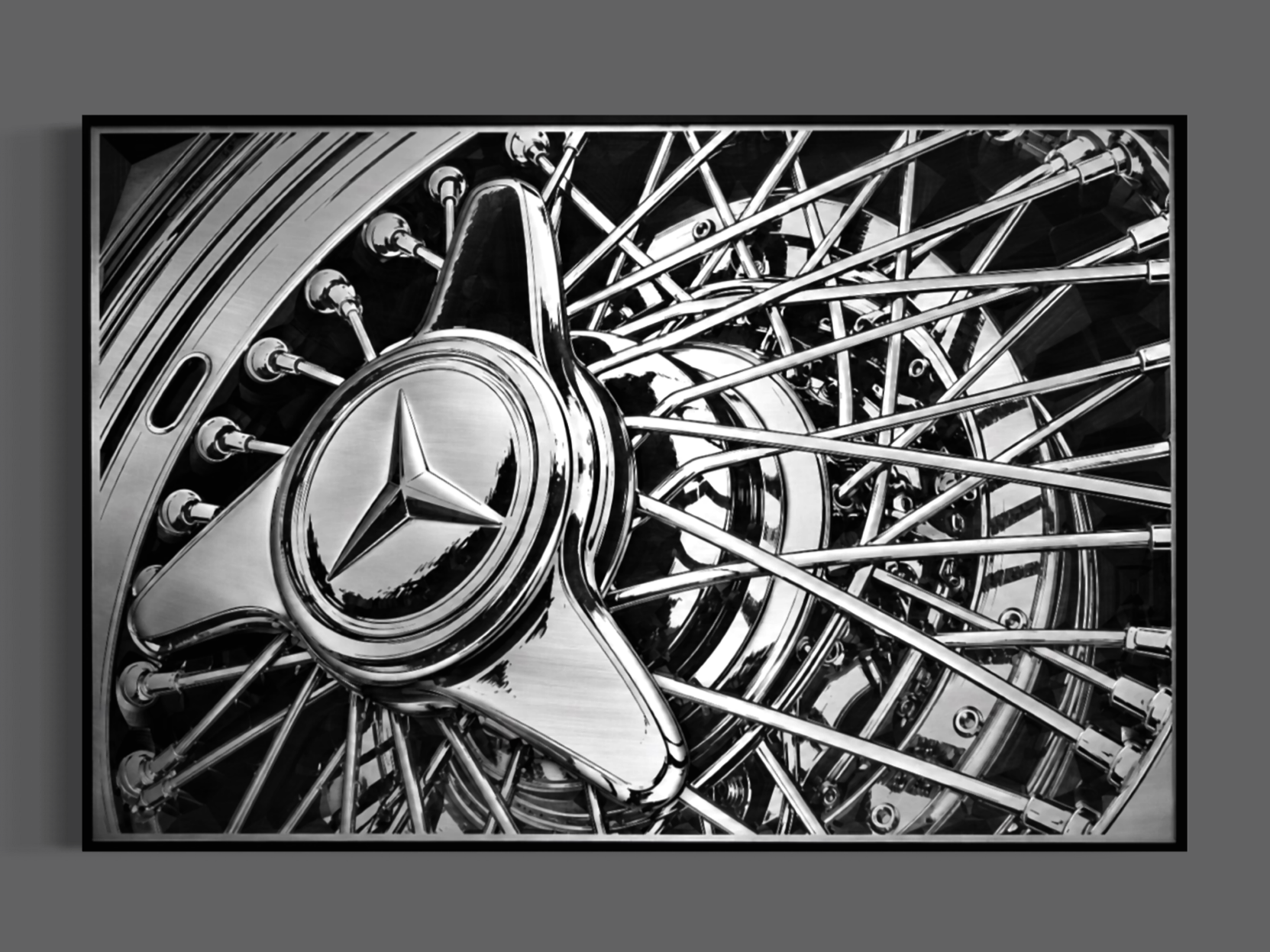 Close-up of a Mercedes-Benz with chrome wheels and Mercedes-Benz emblem in black and white.
