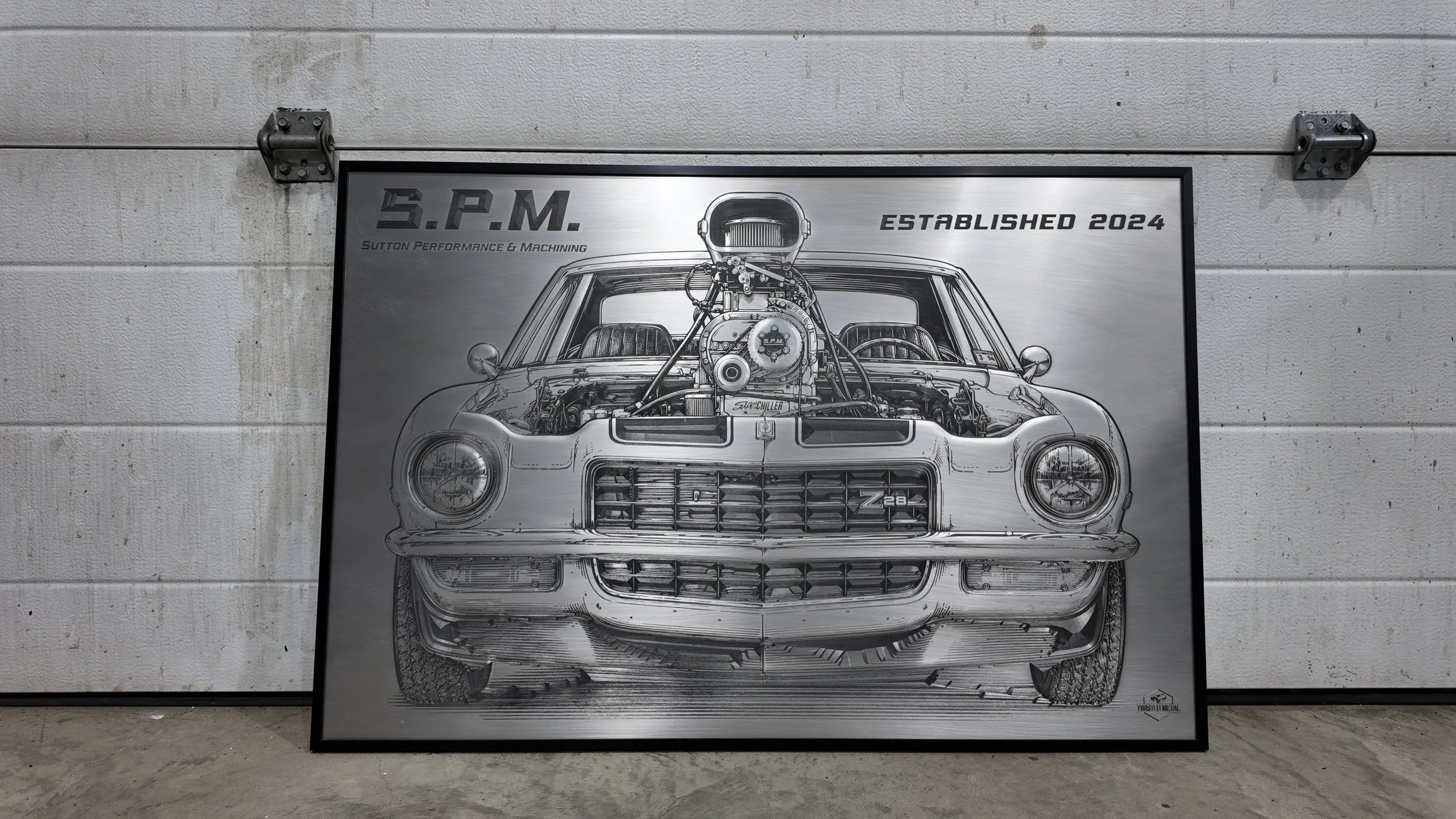 A black and white illustration of a vintage muscle car with a large supercharged engine protruding from the hood, mounted on a gray wall.